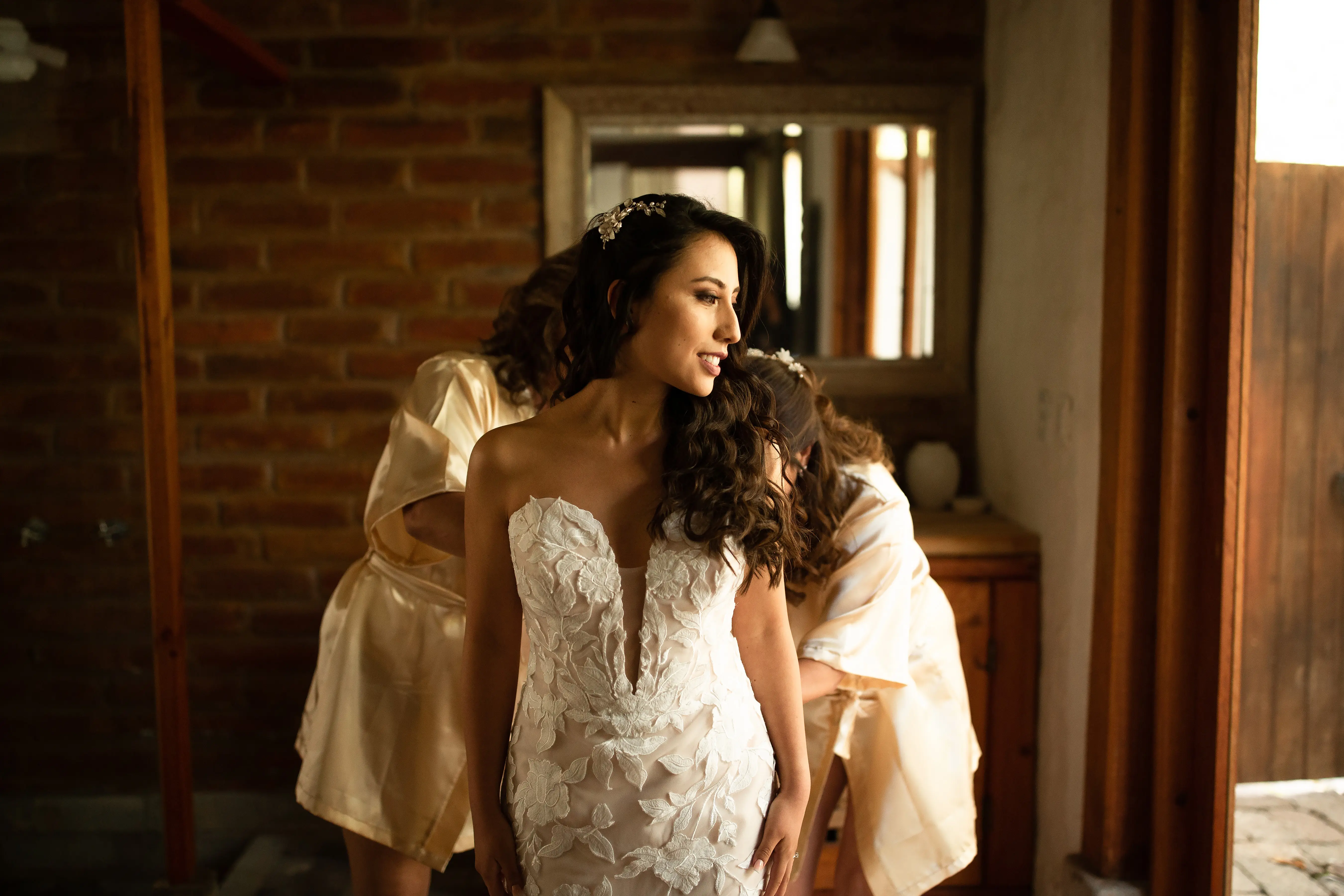 Bride with groom wearing affordable, strapless mermaid wedding dress.