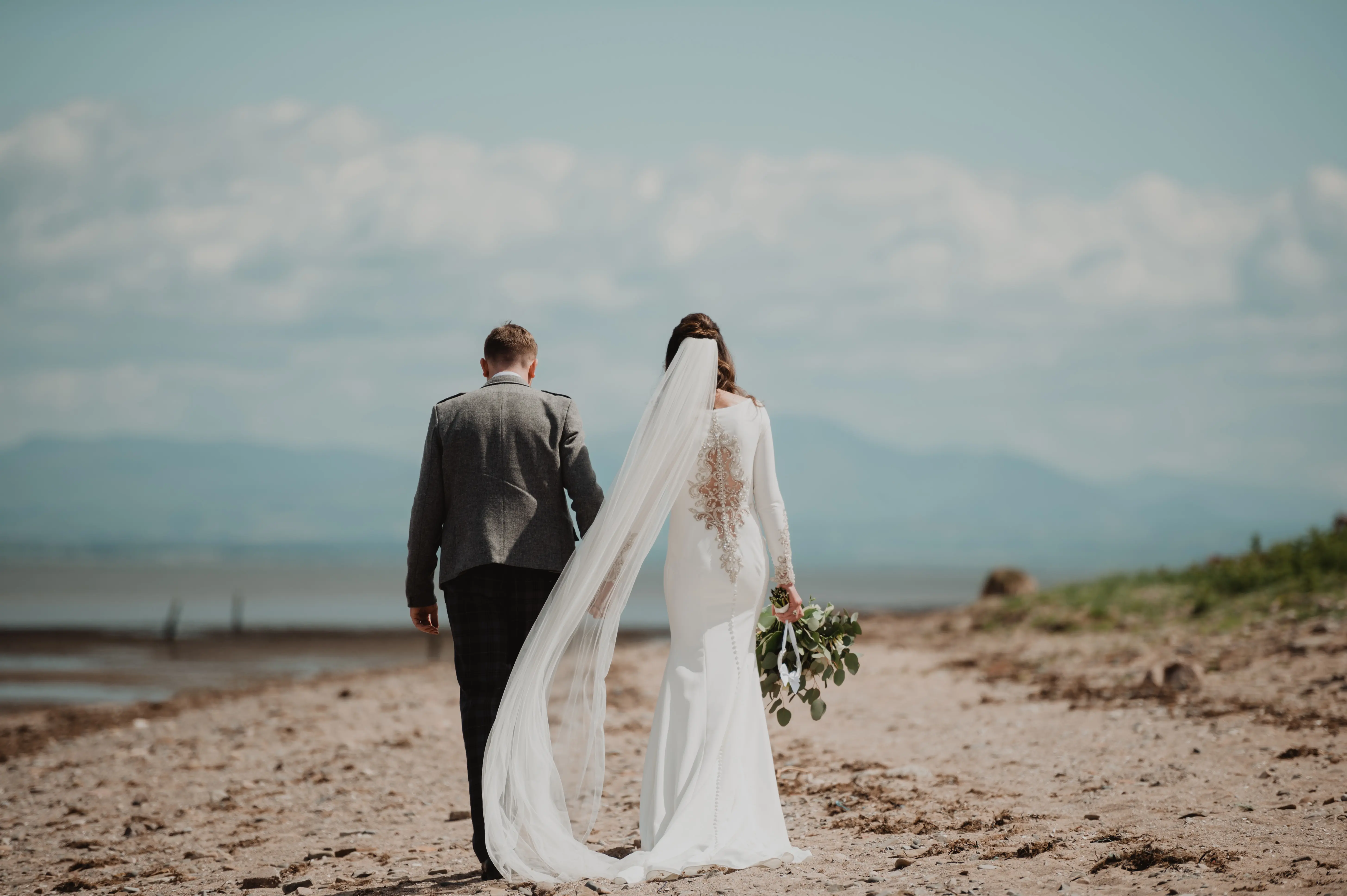 Real Bride in Crepe Fit-and-Flare Wedding Dress with a Statement Back of Beaded Illusion Embroidery Featuring Swarovski Crystals Called Aston by Sottero & Midgely