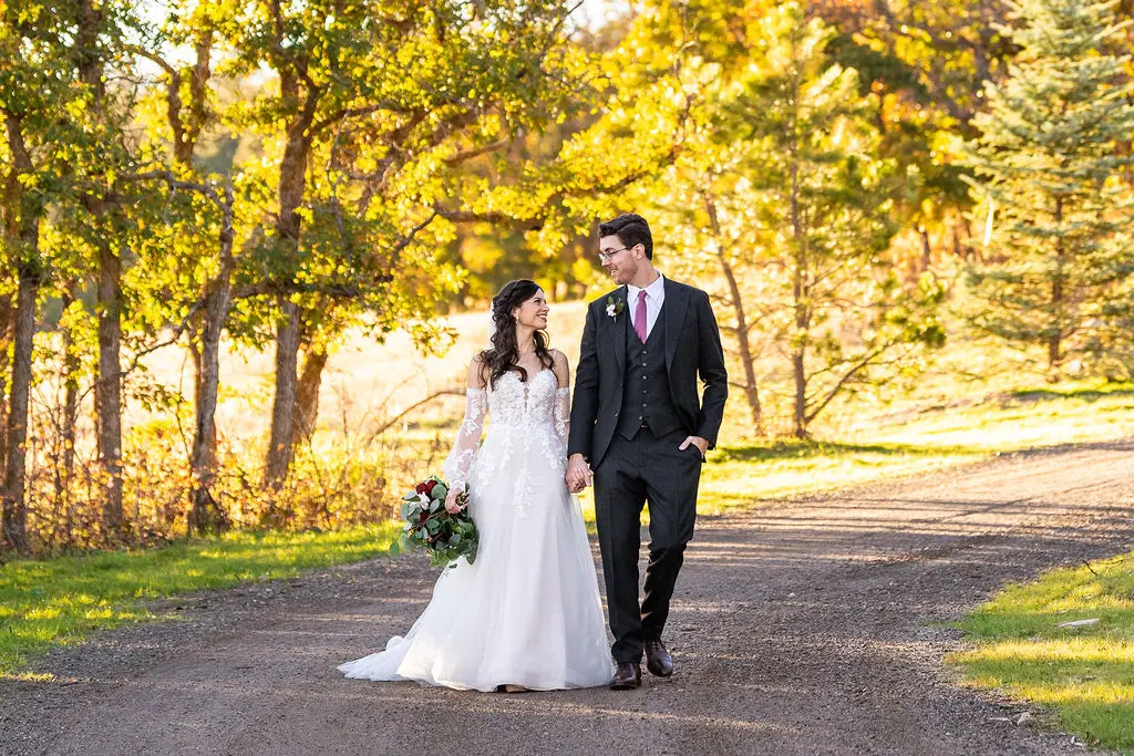 Bride with groom wearing boho A-line wedding dress