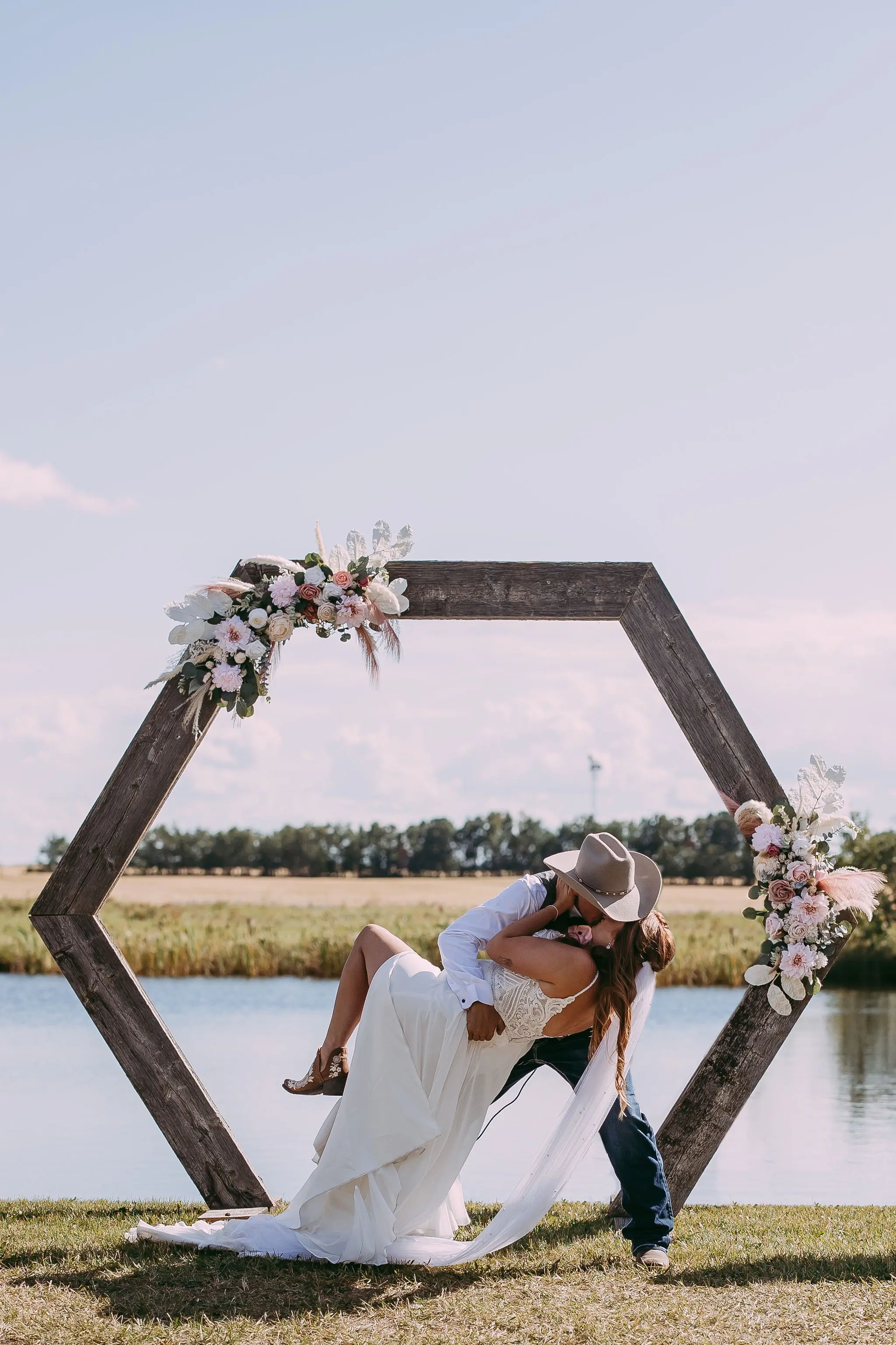 Groom With Bride Wearing Beaded Chiffon Sheath Wedding Dress Lorraine By Rebecca Ingram