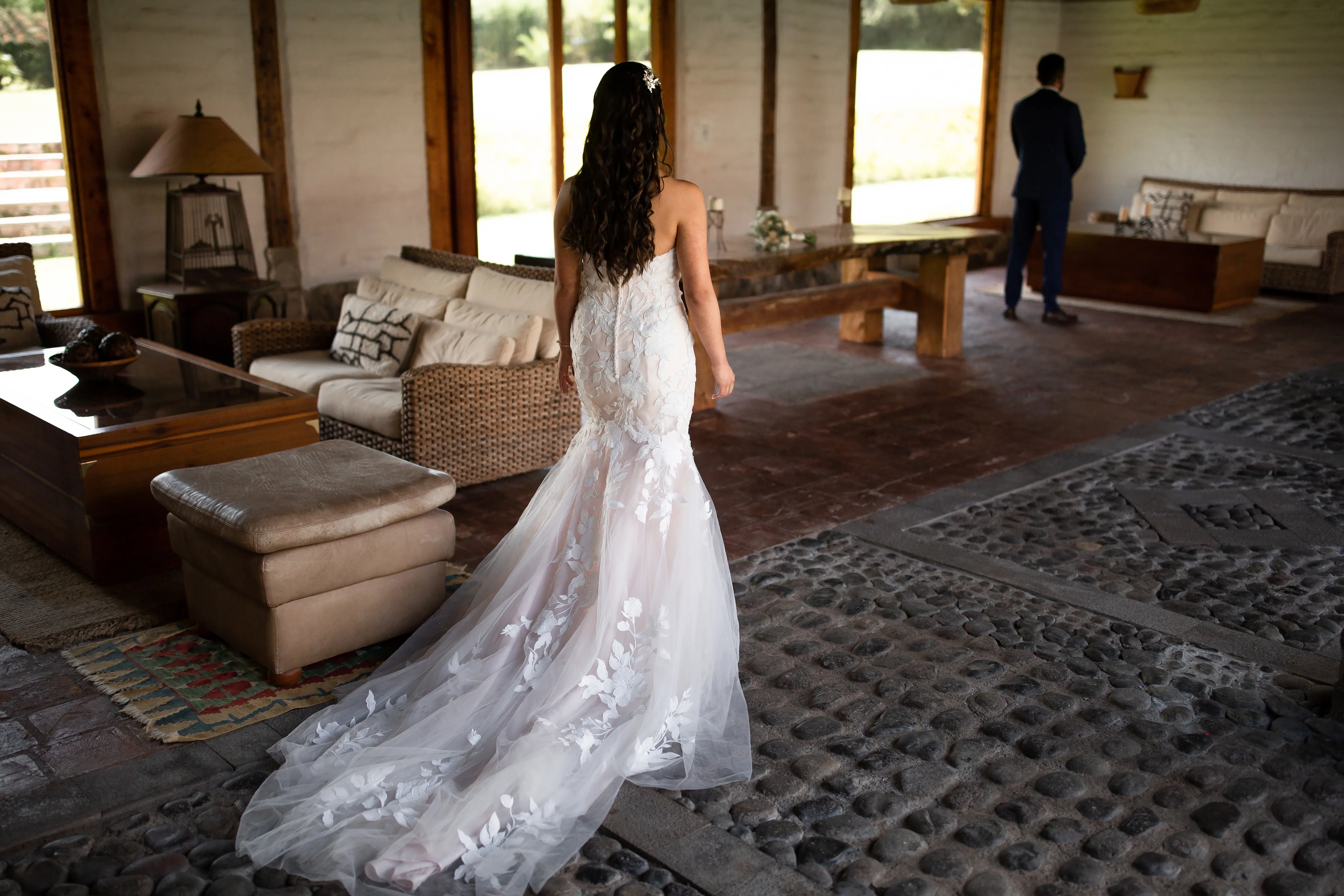 Bride with groom wearing affordable, strapless mermaid wedding dress.