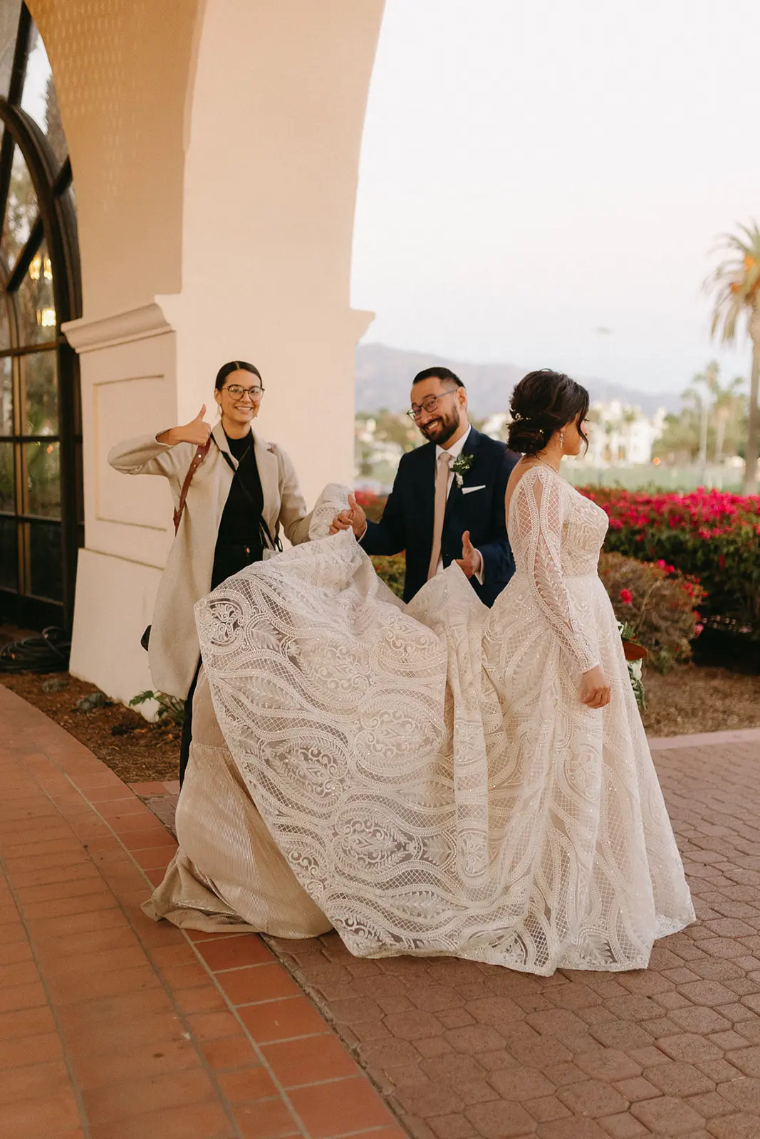 Bride Wearing Lace A-Line Wedding Dress Called Roxanne By Sottero And Midgley And Groom