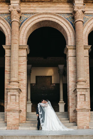 Bride wearing Tuscany Lynette by Maggie Sottero kissing her husband