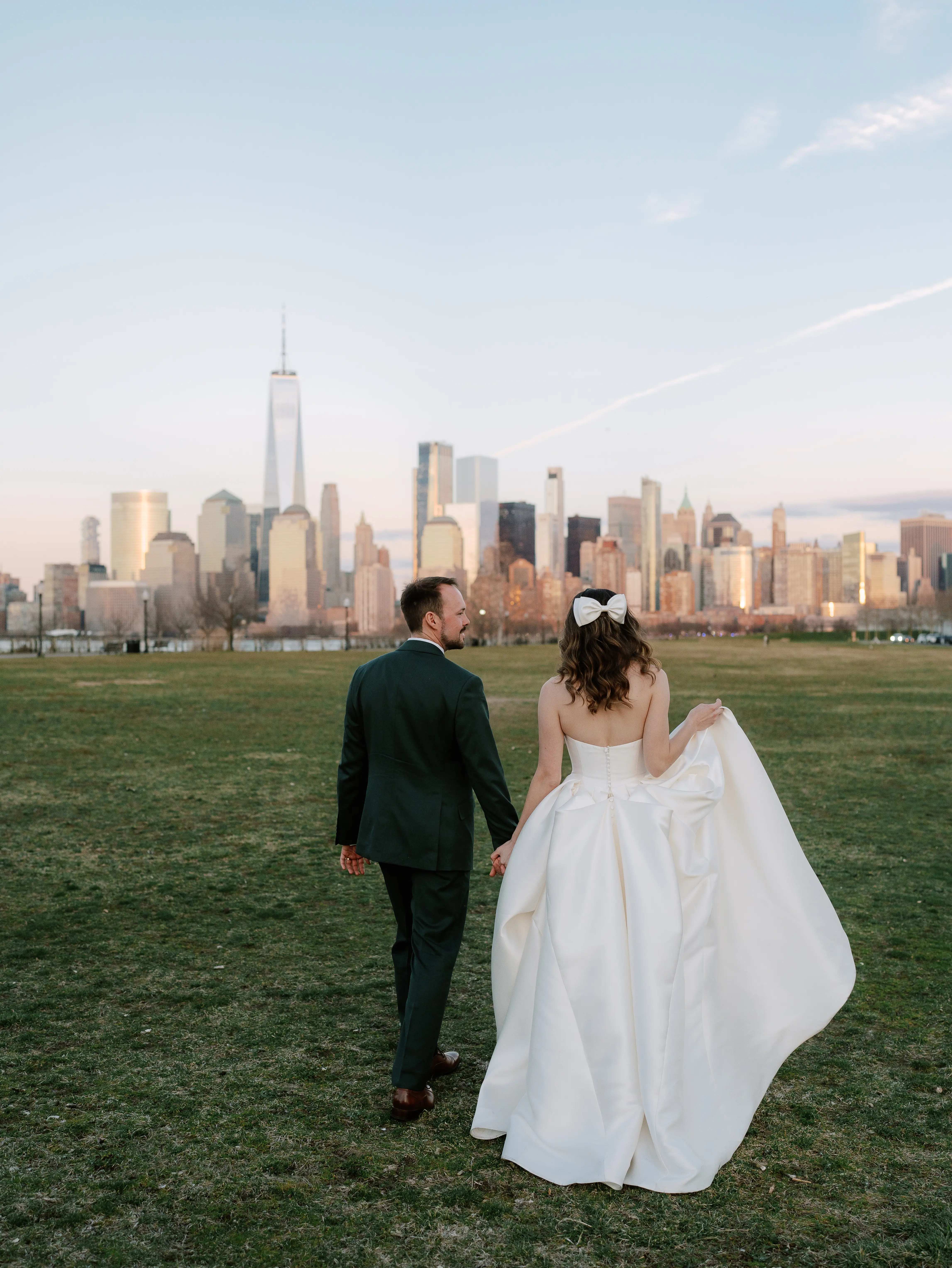 Bride wearing Selena by Maggie Sottero walking with her husband