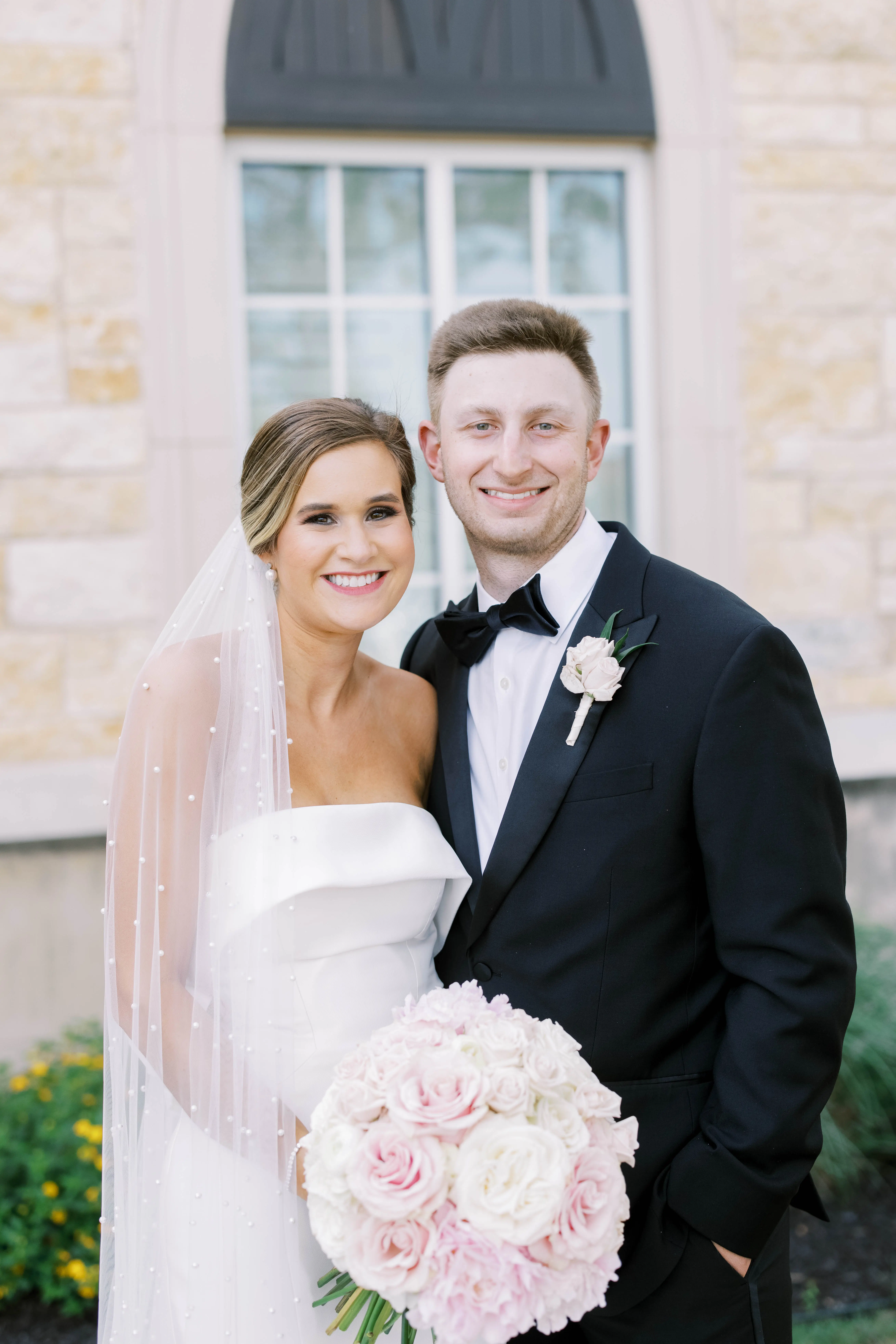 Groom With Bride Wearing Simple Sheath Wedding Dress With Bow Back Called Mitchell By Maggie Sottero