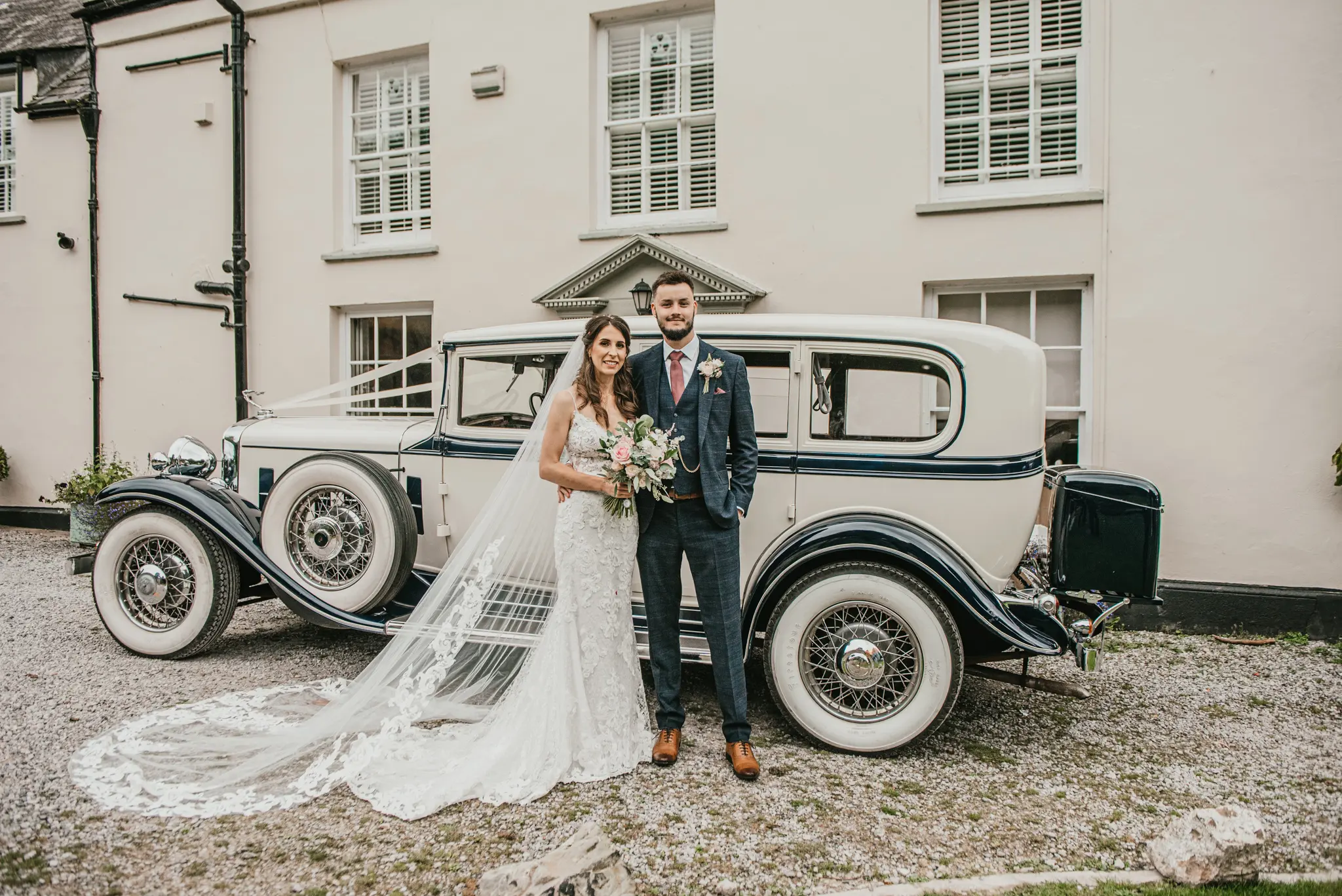 Groom With Bride Wearing Lace Sheath Wedding Dress Tuscany Lynette By Maggie Sottero