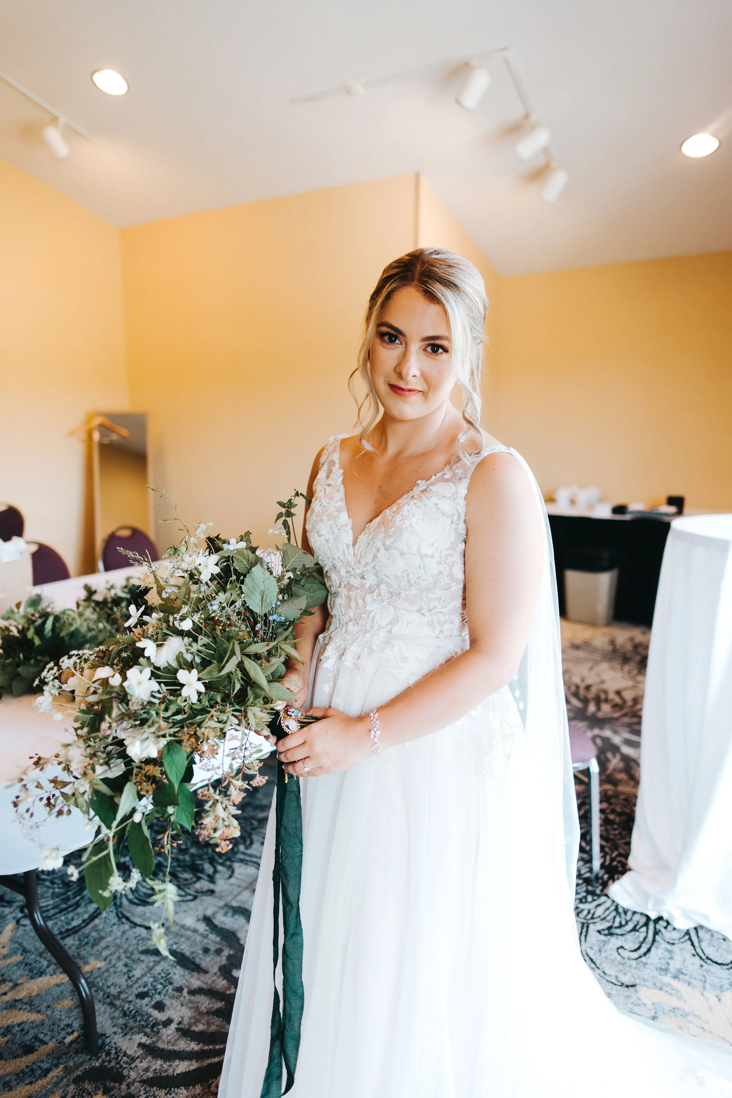 Bride Wearing V-Neck A-Line Wedding Dress Minerva By Rebecca Ingram