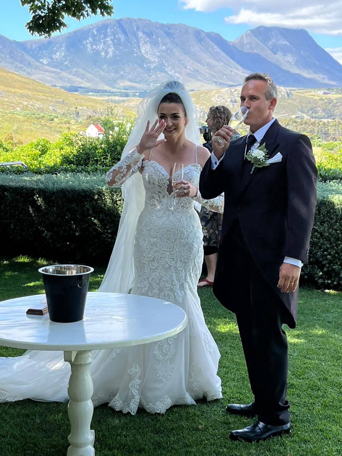 Bride In Lace Fit And Flare Wedding Dress Called Fiona By Maggie Sottero With Groom