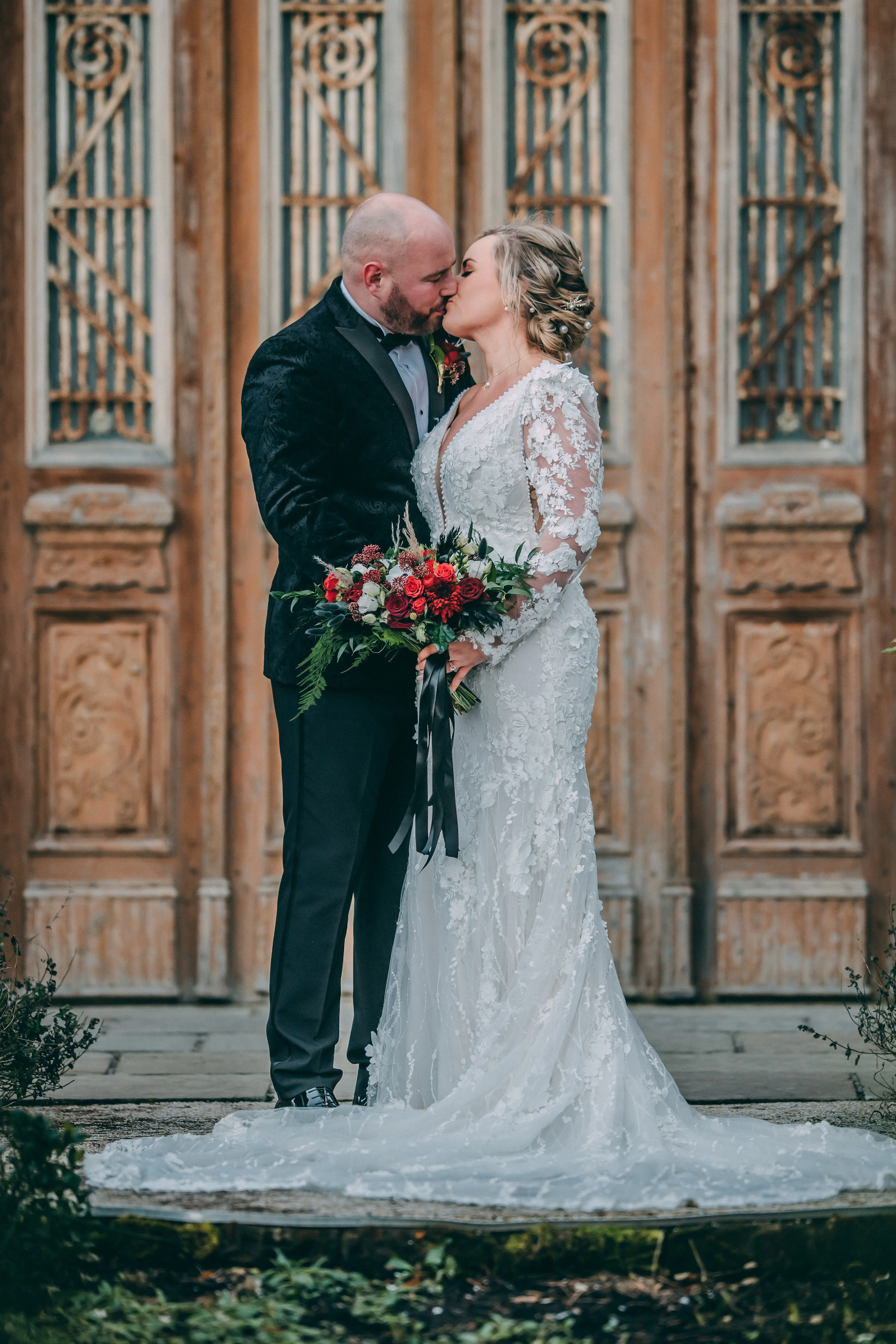 Groom With Bride Wearing Vintage Mermaid Wedding Dress With 3-D Floral Motifs Cruz By Sottero And Midgley