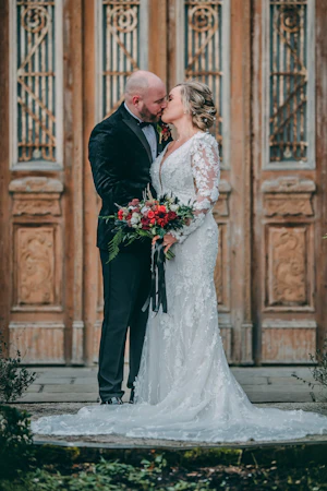 Groom With Bride Wearing Vintage Mermaid Wedding Dress With 3-D Floral Motifs Cruz By Sottero And Midgley
