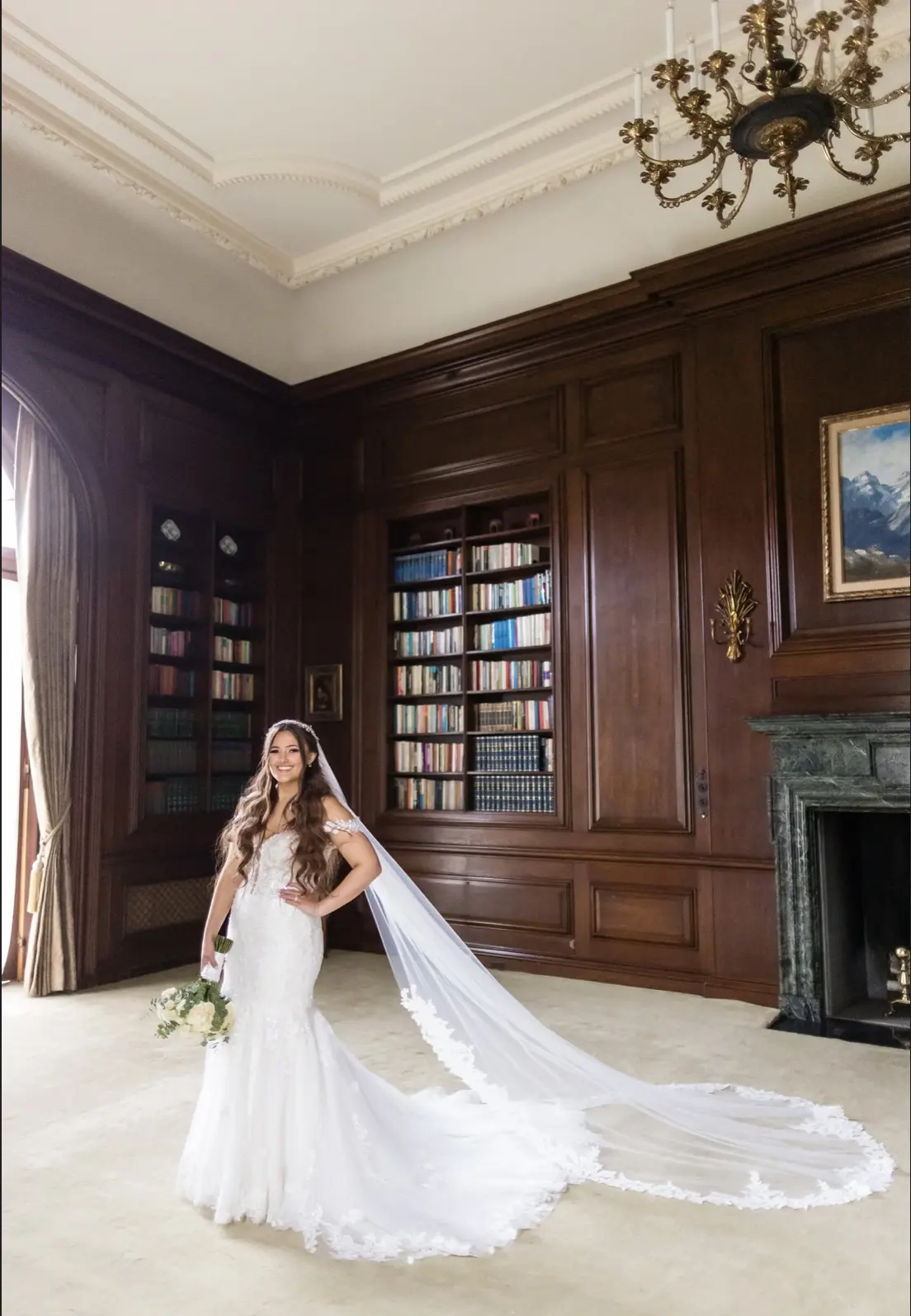 Bride wearing Lennon wedding dress by Maggie Sottero in a library