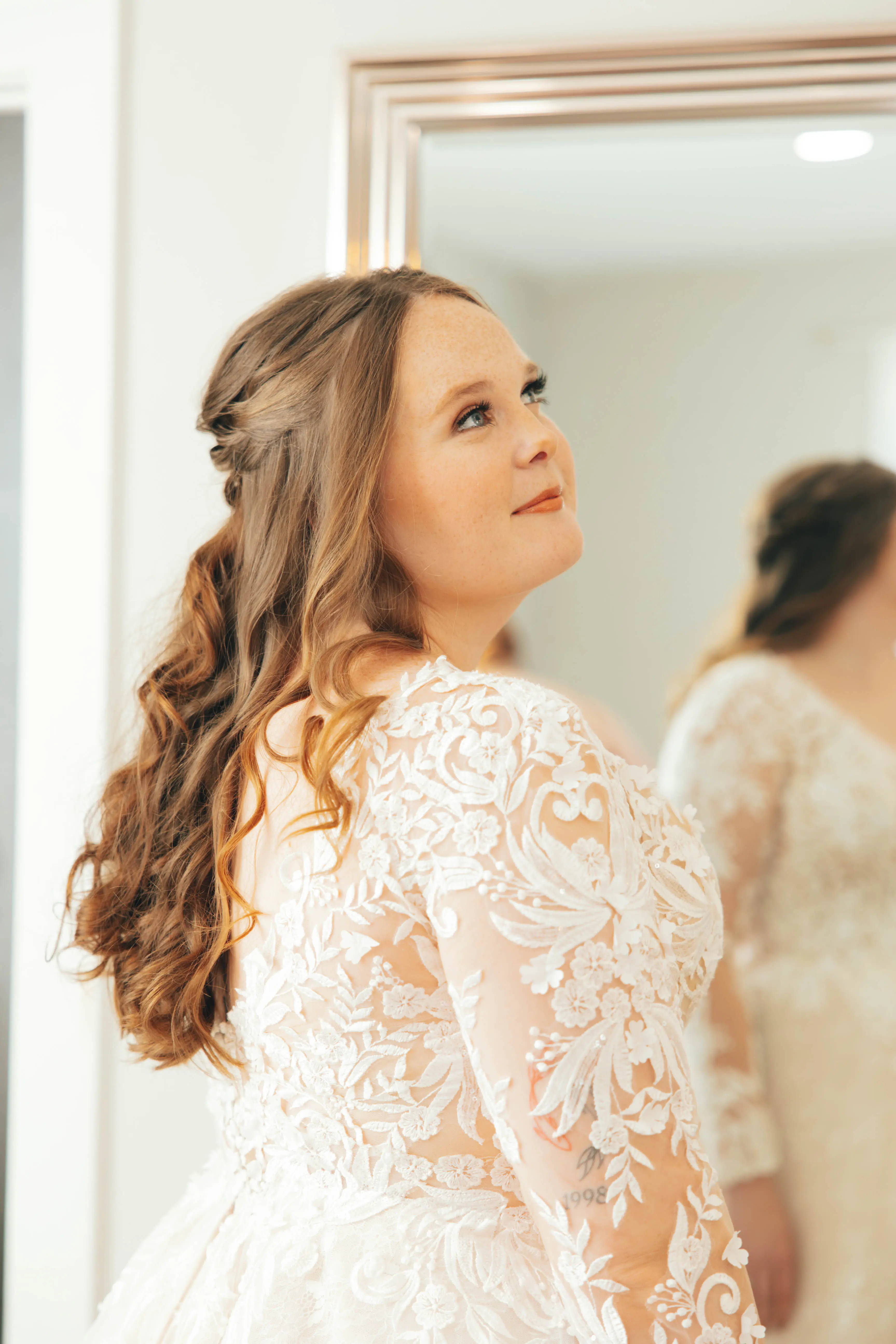 Bride wearing Zander wedding gown by Sottero and Midgley