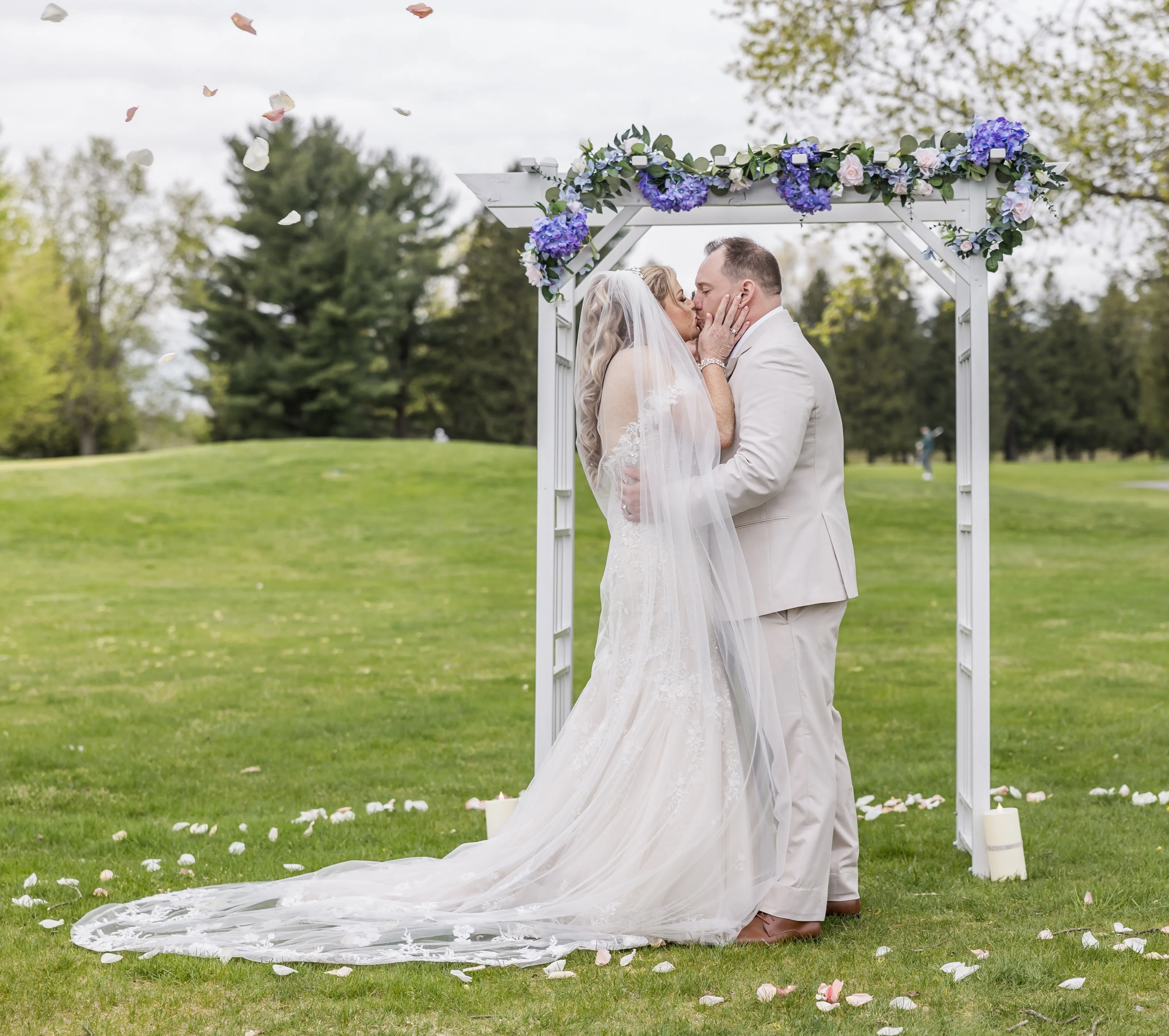 Bride wearing Lennon by Maggie Sottero kissing her husband