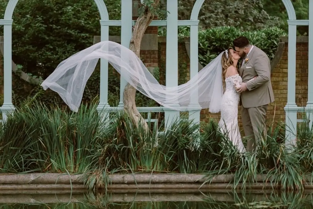 Bride Wearing Lace Fit-And-Flare Wedding Dress Called Fiona By Maggie Sottero With Groom