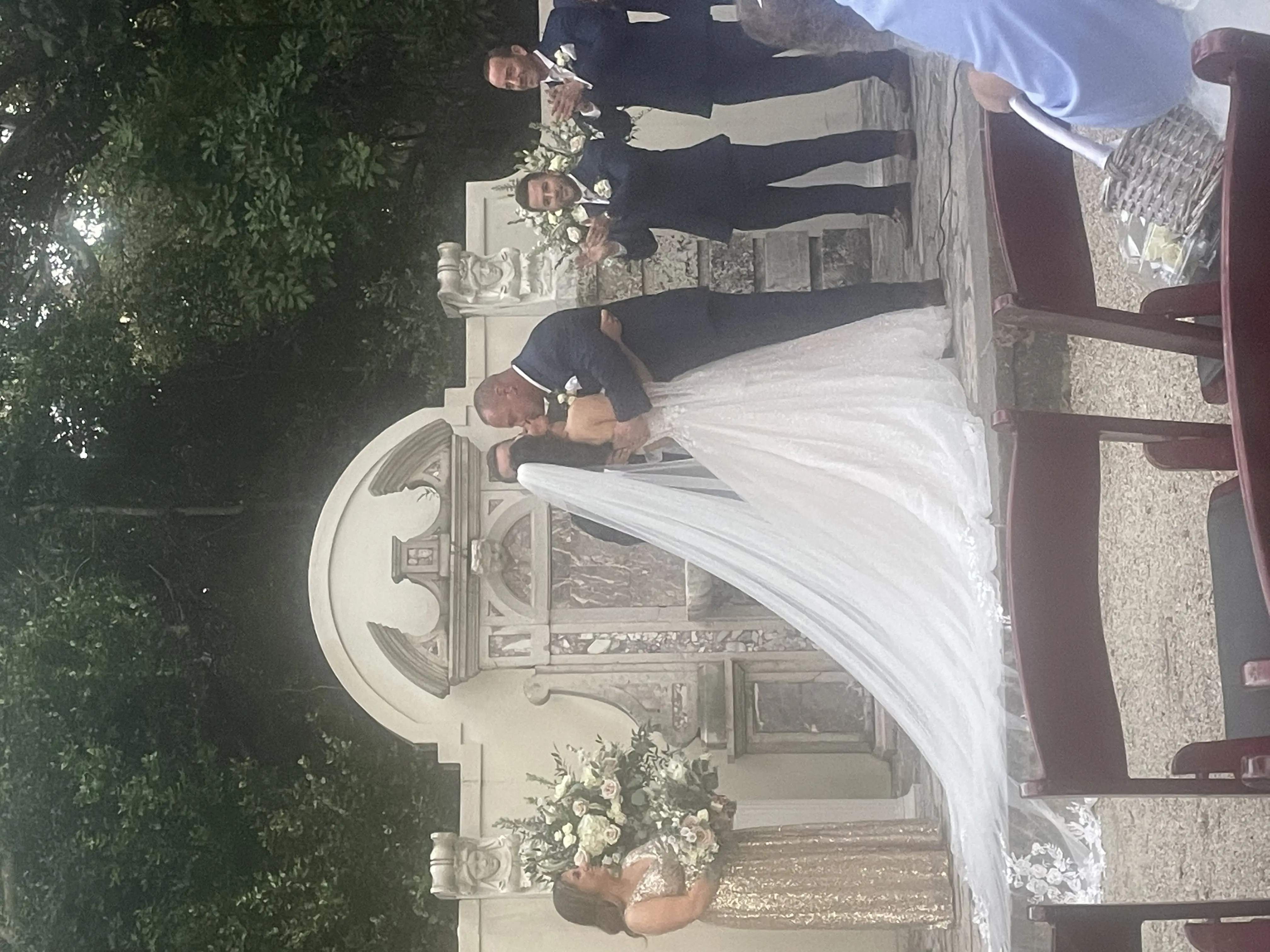 Bride And Groom Share Kiss. Bride Wearing Sparkly Fairytale Ball Gown Wedding Dress Called Shasta By Sottero And Midgley