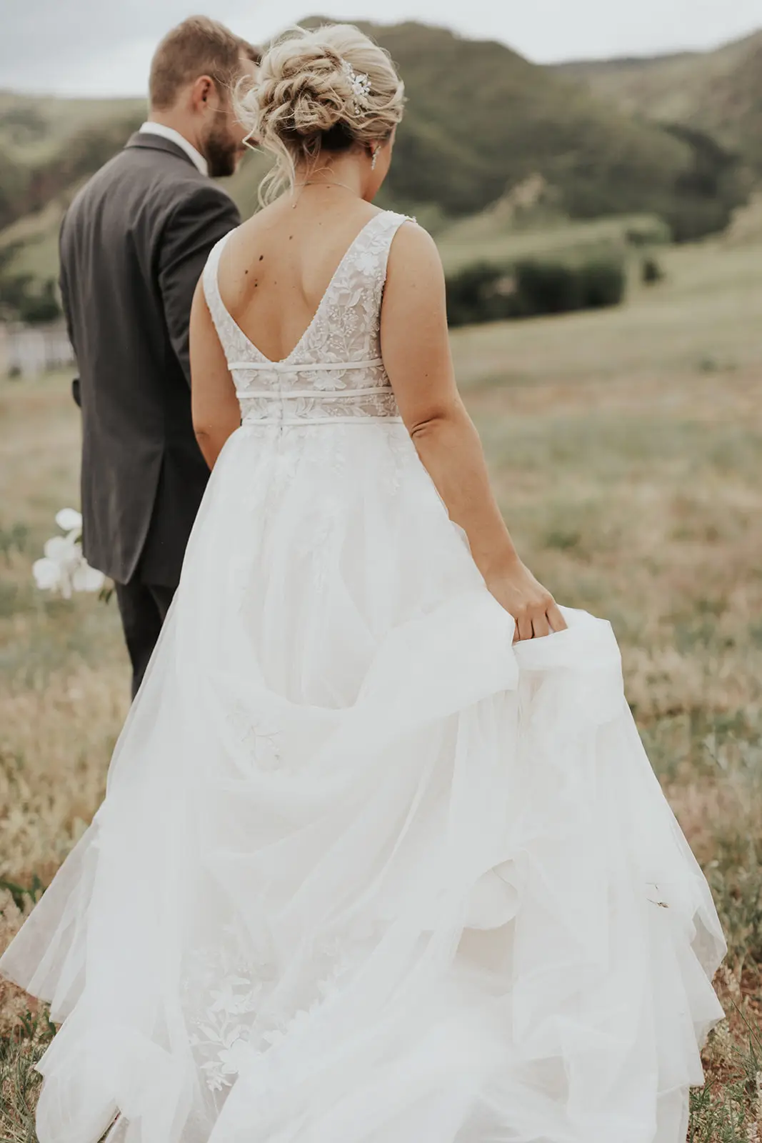 Bride In Lace Backless Wedding Dress Called Raelynn By Rebecca Ingram