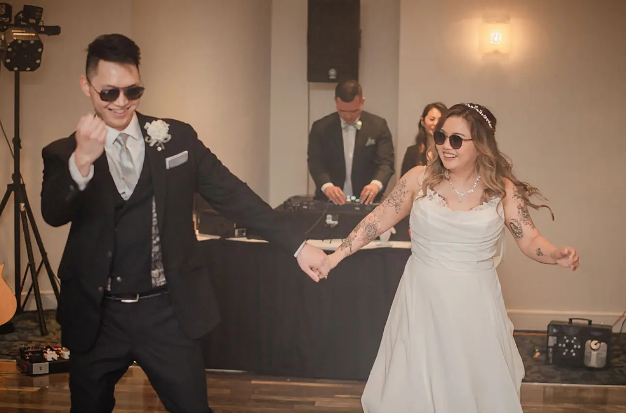 Bride wearing Jessica by Maggie Sottero dancing with her husband