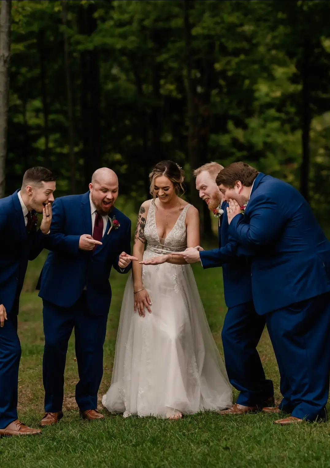 Bride wearing Boho Lace Wedding Dress called Raelynn by Rebecca Ingram with the groomsmen