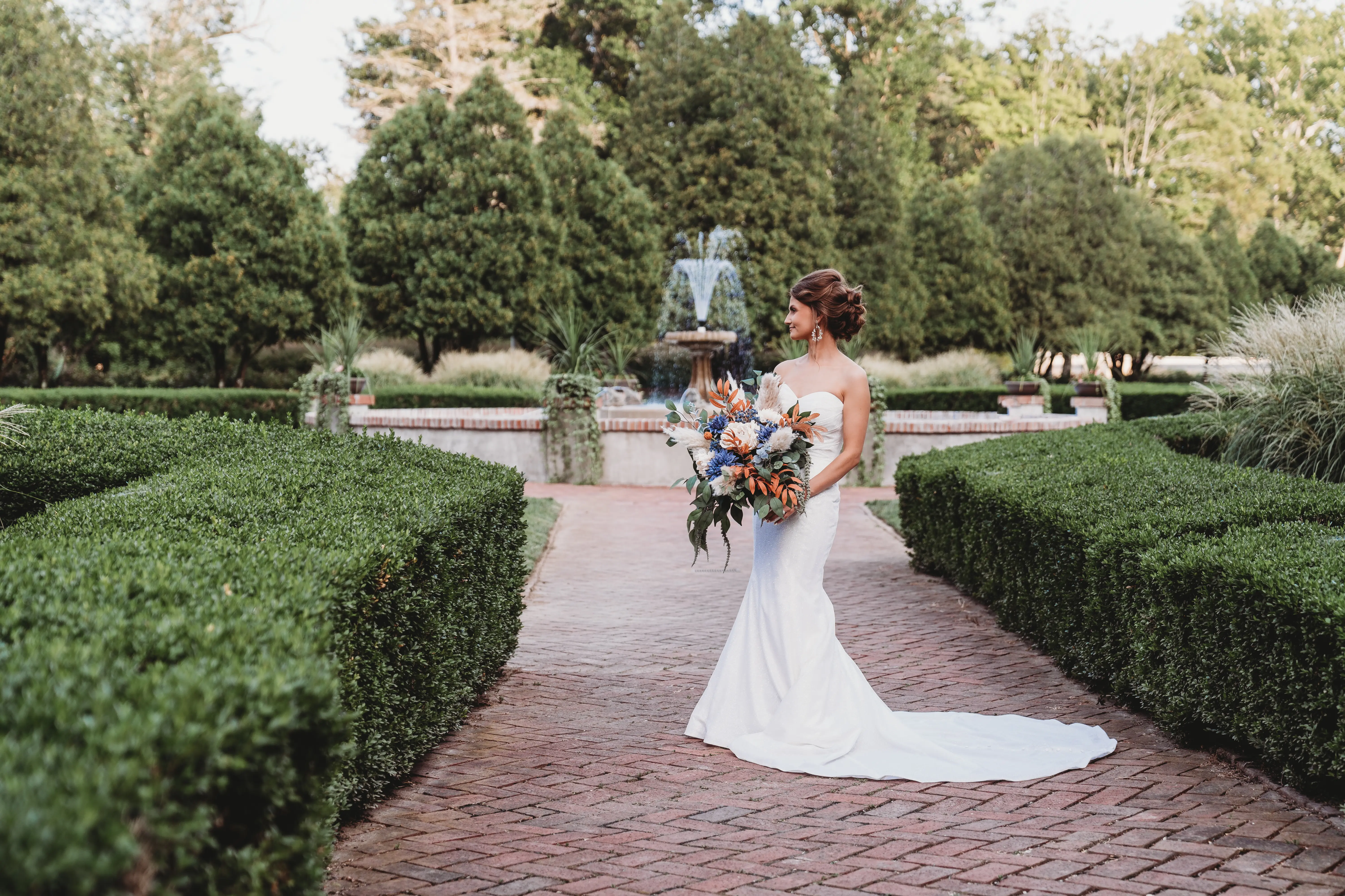 Bride Wearing Sparkly Fit And Flare Wedding Dress Called Anniston Lane By Maggie Sottero In A Garden