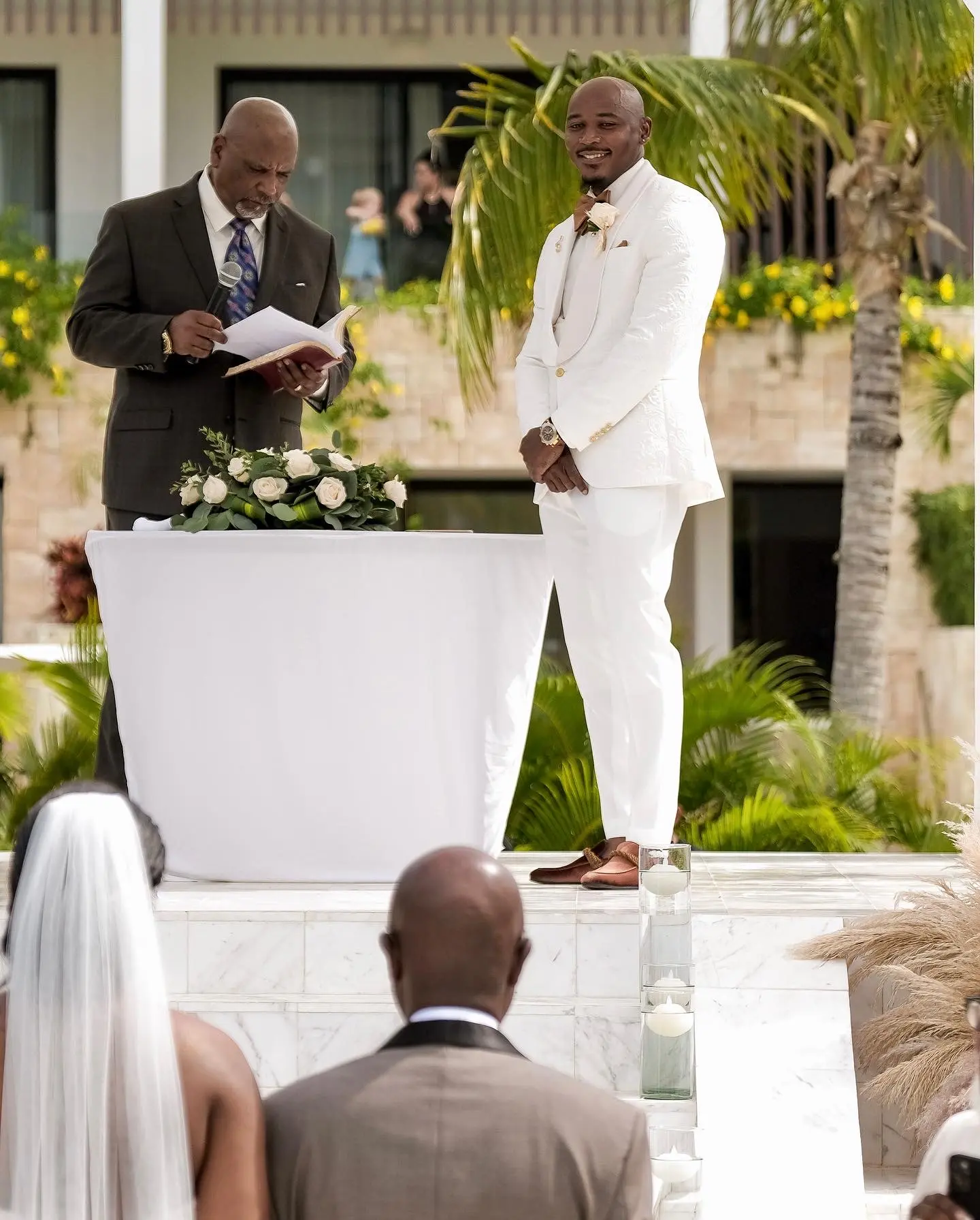 Groom In White Suit Waiting For Bride