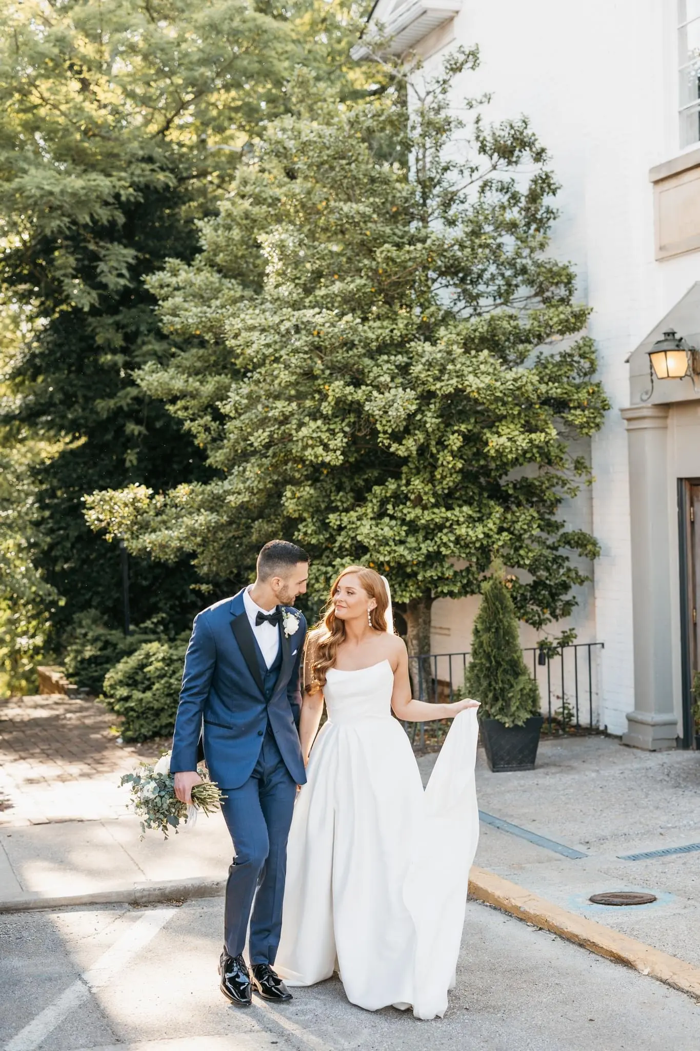 Bride wearing Aspen by Sottero and Midgley walking with her husband