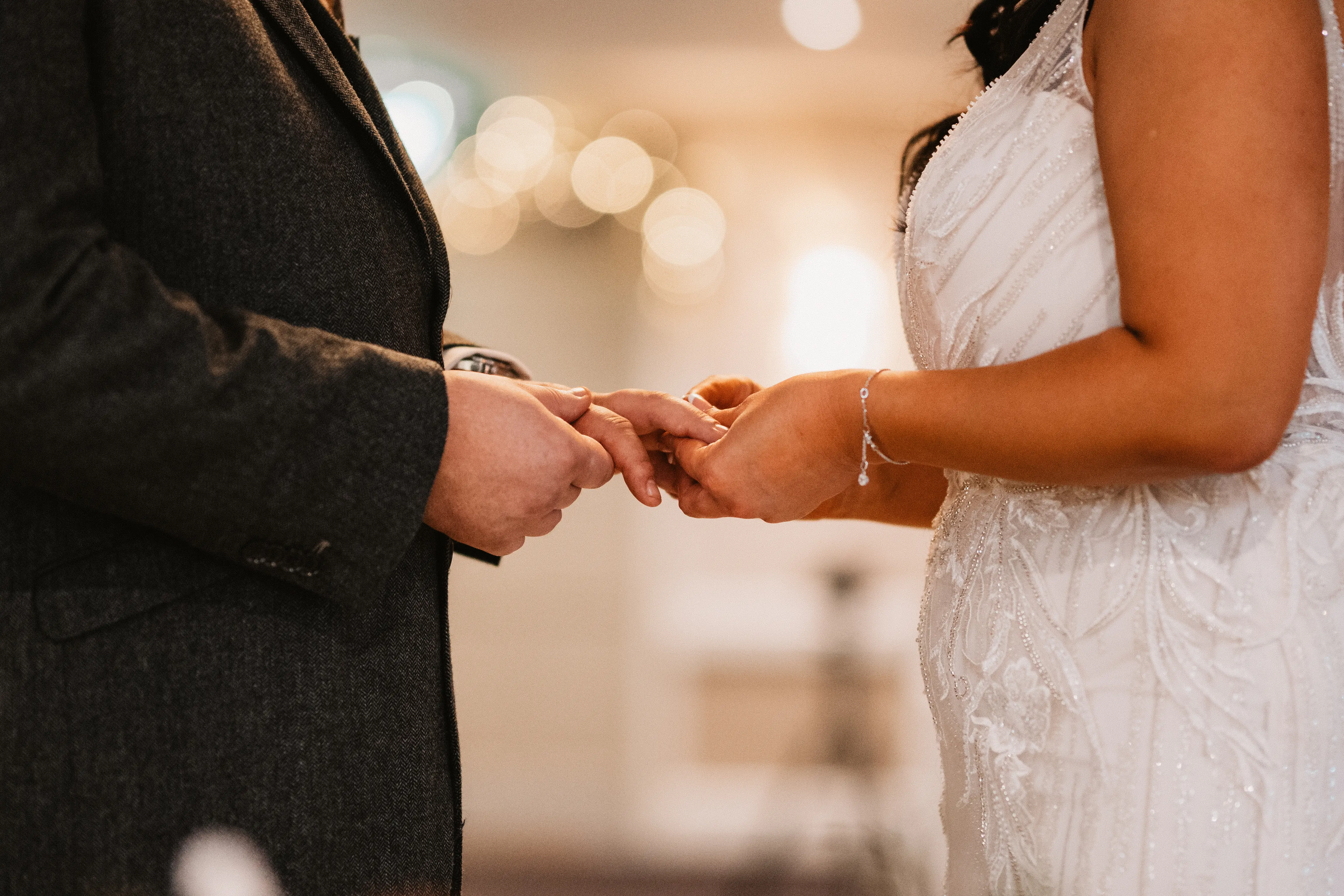 Bride Wearing Art Deco Wedding Dress Called Luella By Sottero And Midgley Exchanging Rings With Groom