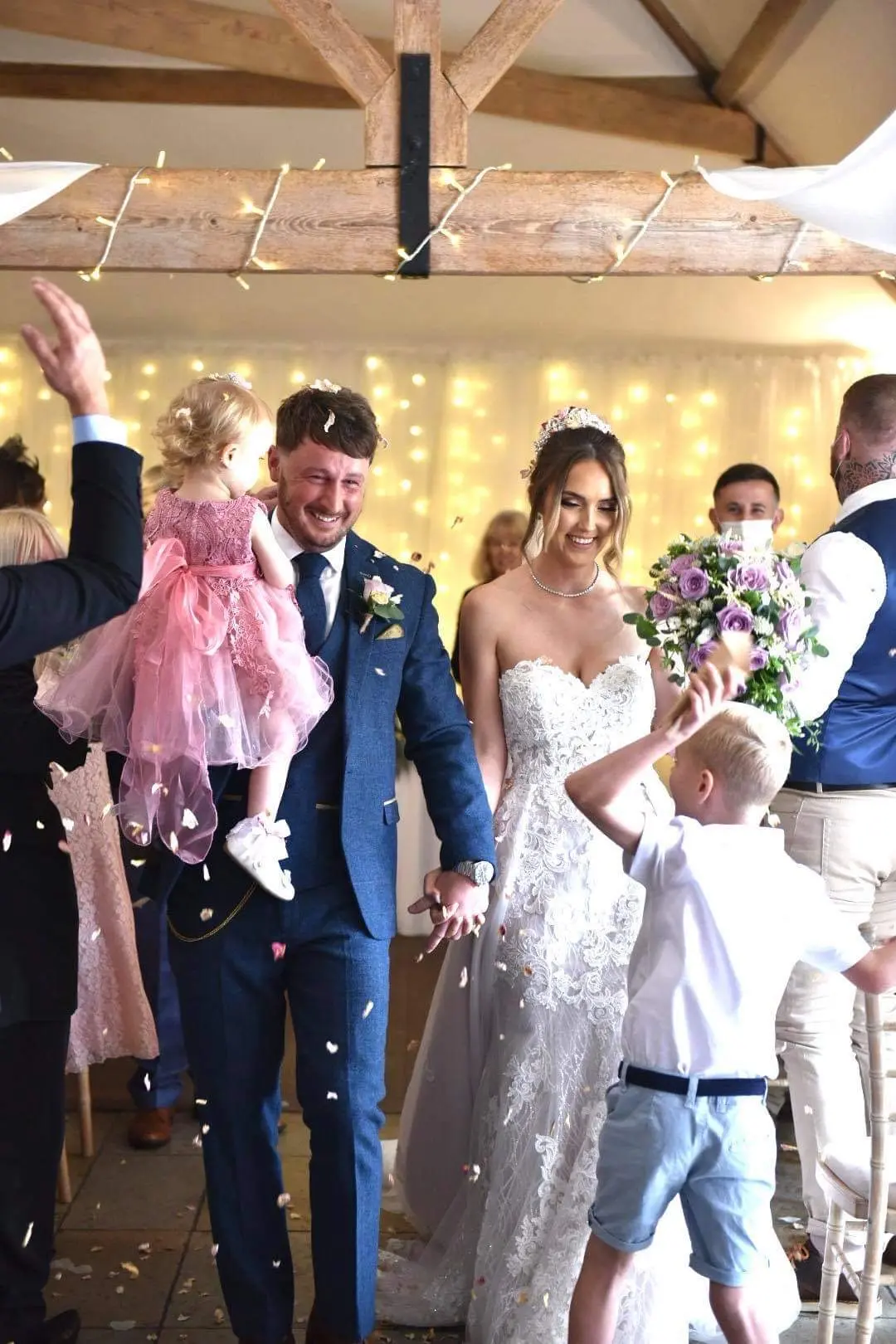 bride with groom in lacy mermaid wedding dress