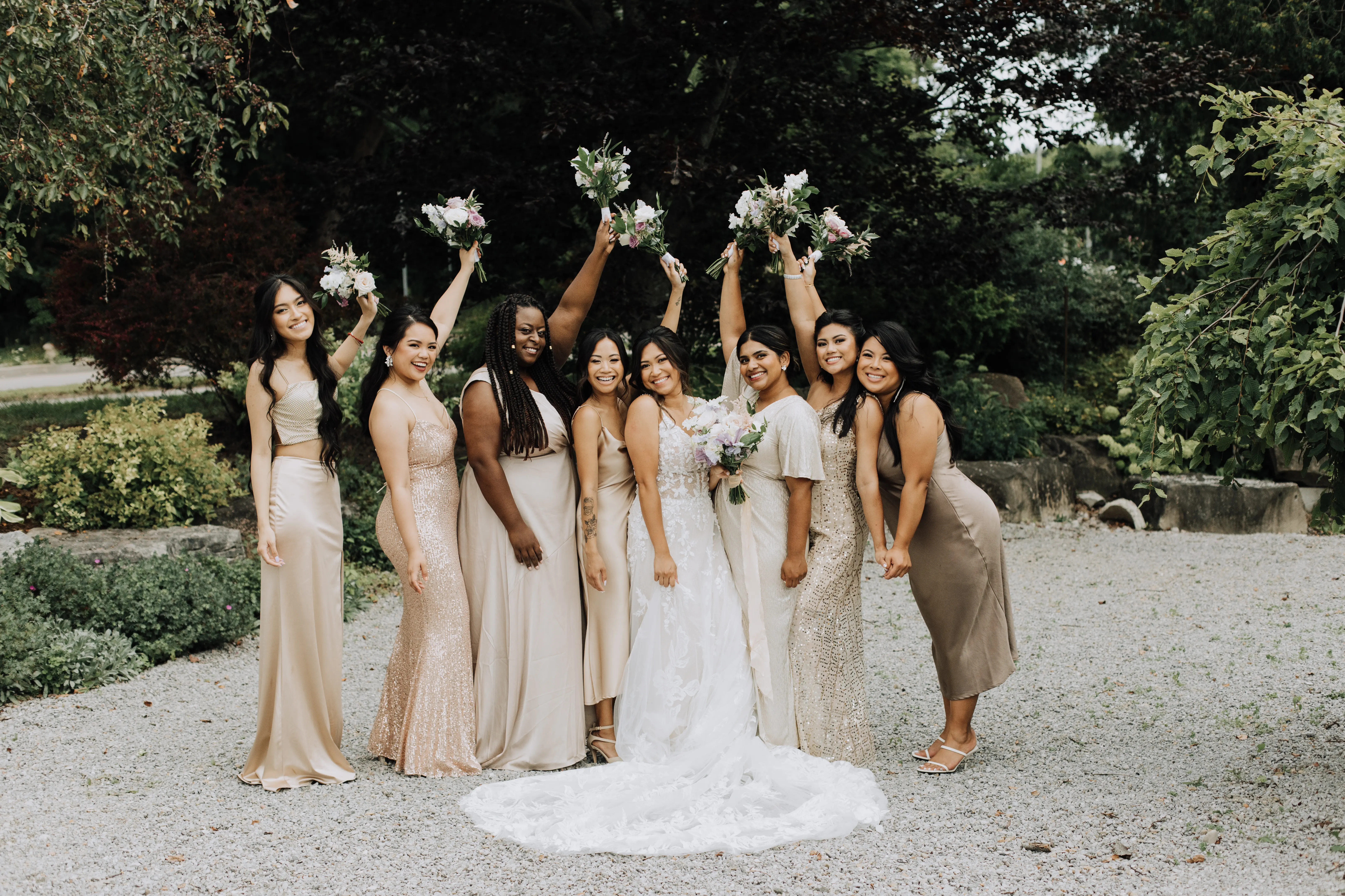 Bride Wearing A-Line Romantic Wedding Dress Called Marlow By Sottero And Midgley Holding Bouquets With Bridesmaids