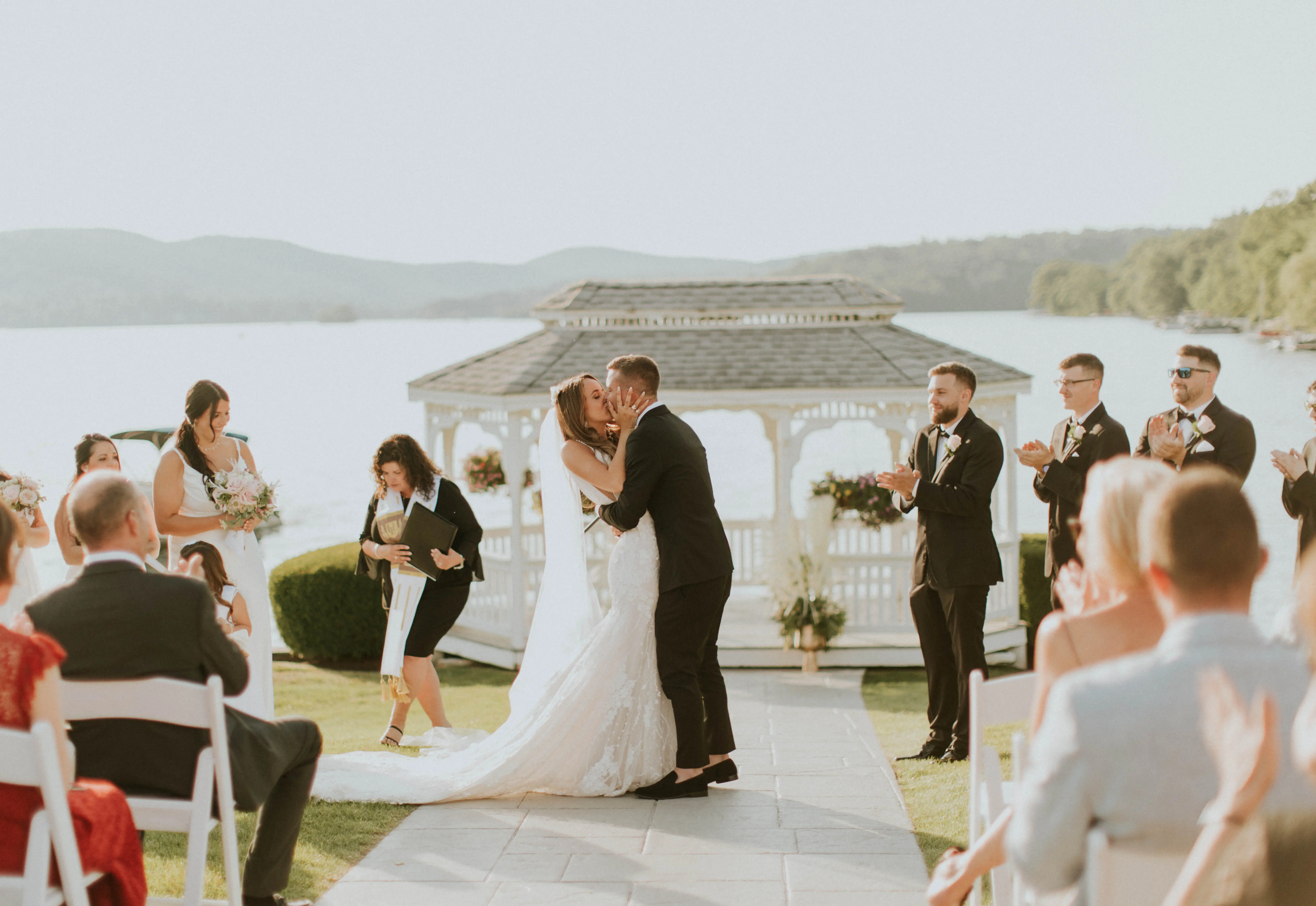 Groom Kissing Bride in Mermaid Wedding Dress with 3-D Floral Motifs Called Cruz by Sottero & Midgley