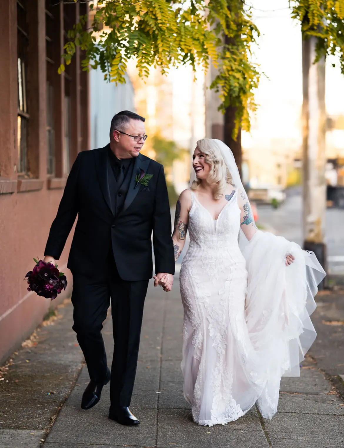 Bride Wearing Beaded Lace Wedding Dress Called Franklynn By Maggie Sottero Walking With Groom Holding Hands