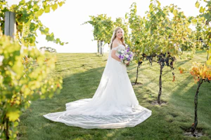 Bride Wearing Lace Wedding Dress Called Lennon By Maggie Sottero In A Vineyard