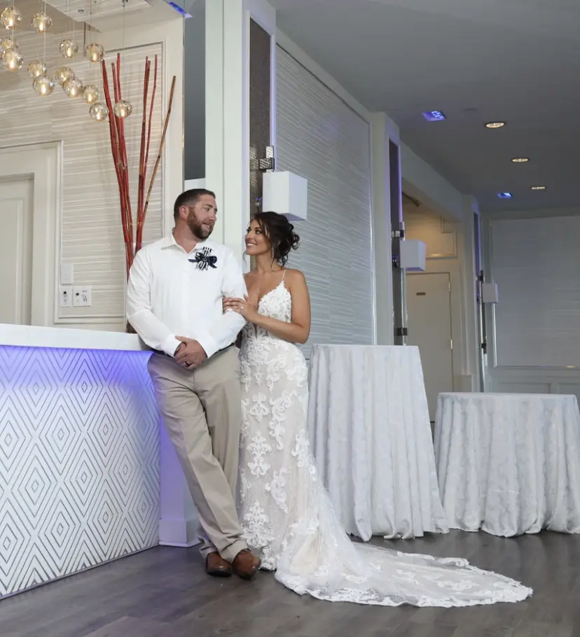 Groom With Bride Wearing Lace Sheath Wedding Dress Tuscany Lynette By Maggie Sottero