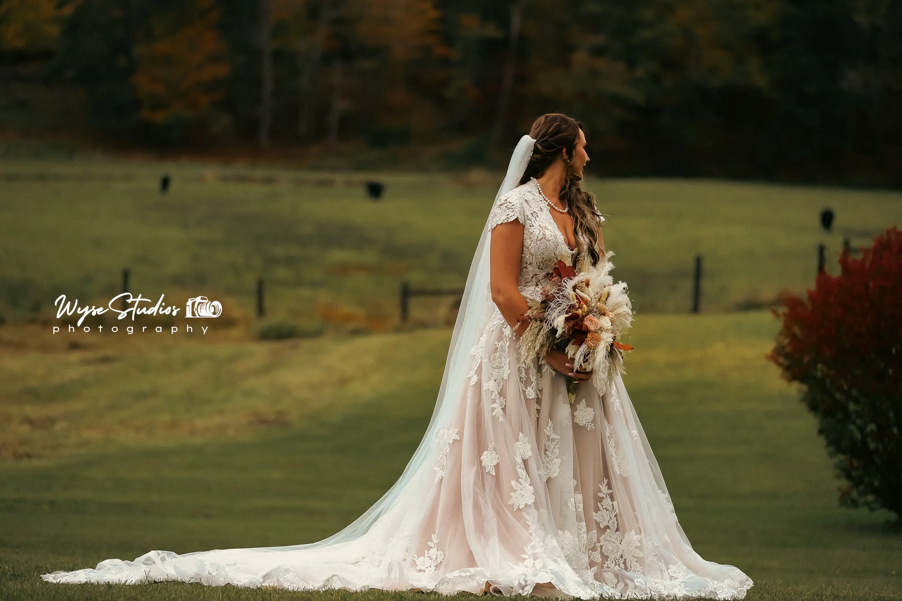 Bride wearing Kingsley wedding gown by Sottero and Midgley