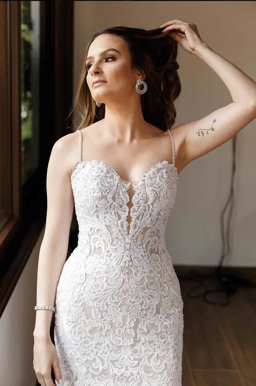 Bride in Wedding Gown with Beaded Lace Motifs and Plunging Illusion Sweetheart Neckline Alistair by Maggie Sottero