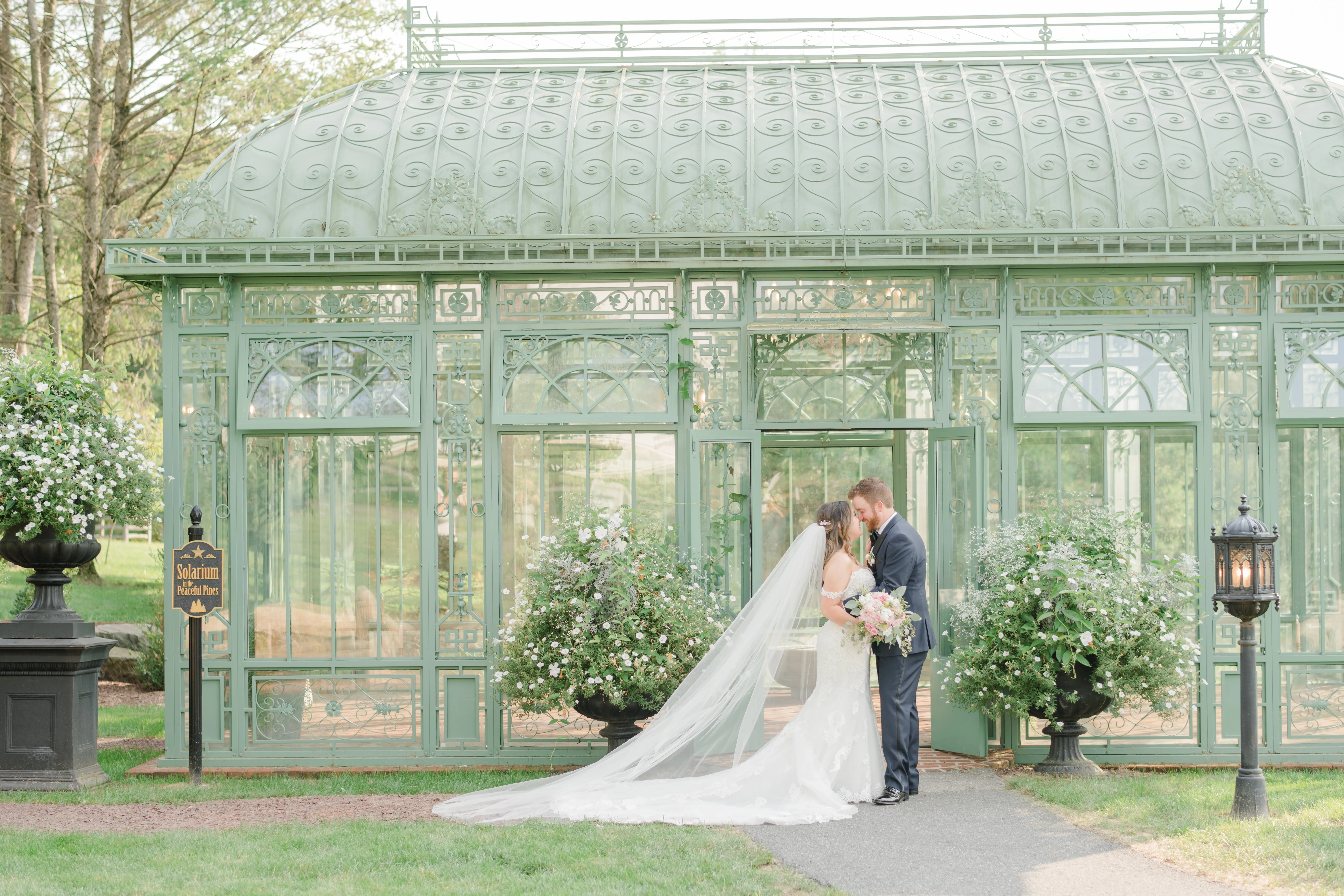 Real bride in sparkly lace fit-and-flare bridal dress with plunging illusion sweetheart neckline called Fiona by Maggie Sottero