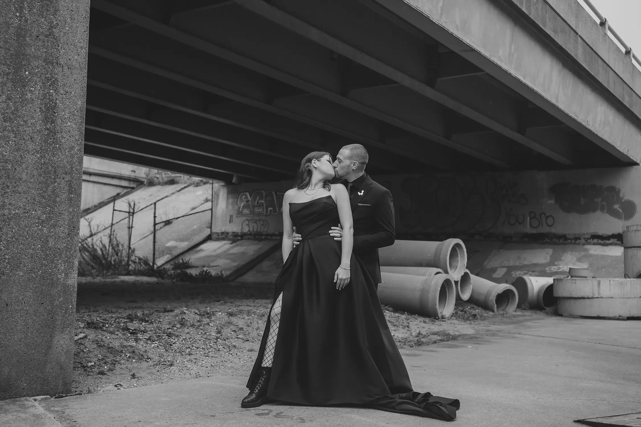 Bride wearing Aspen wedding dress by Sottero and Midgley kissing her husband