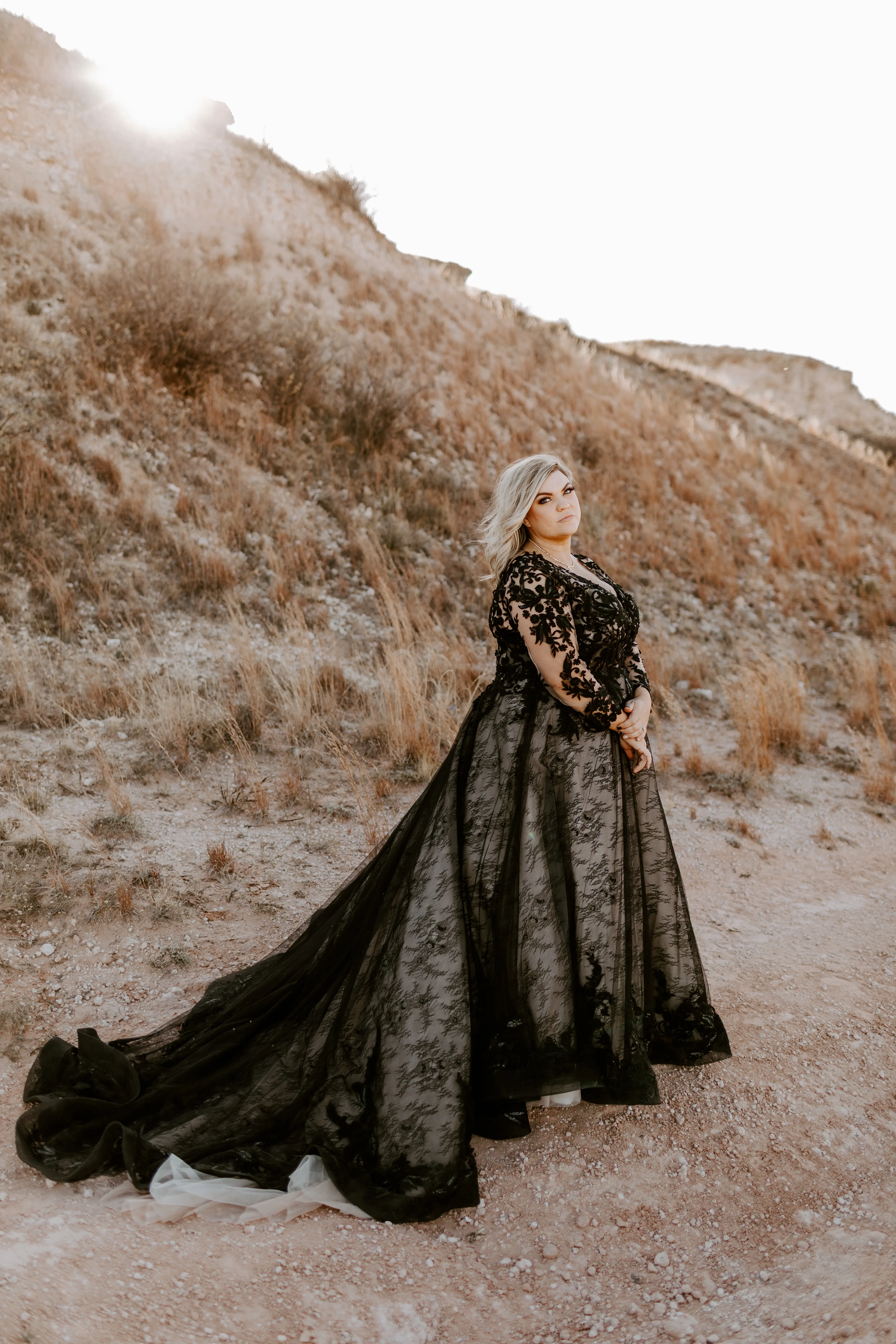 Bride Wearing Black Lace Wedding Dress Called Zander By Sottero And Midgley On A Beach Hillside