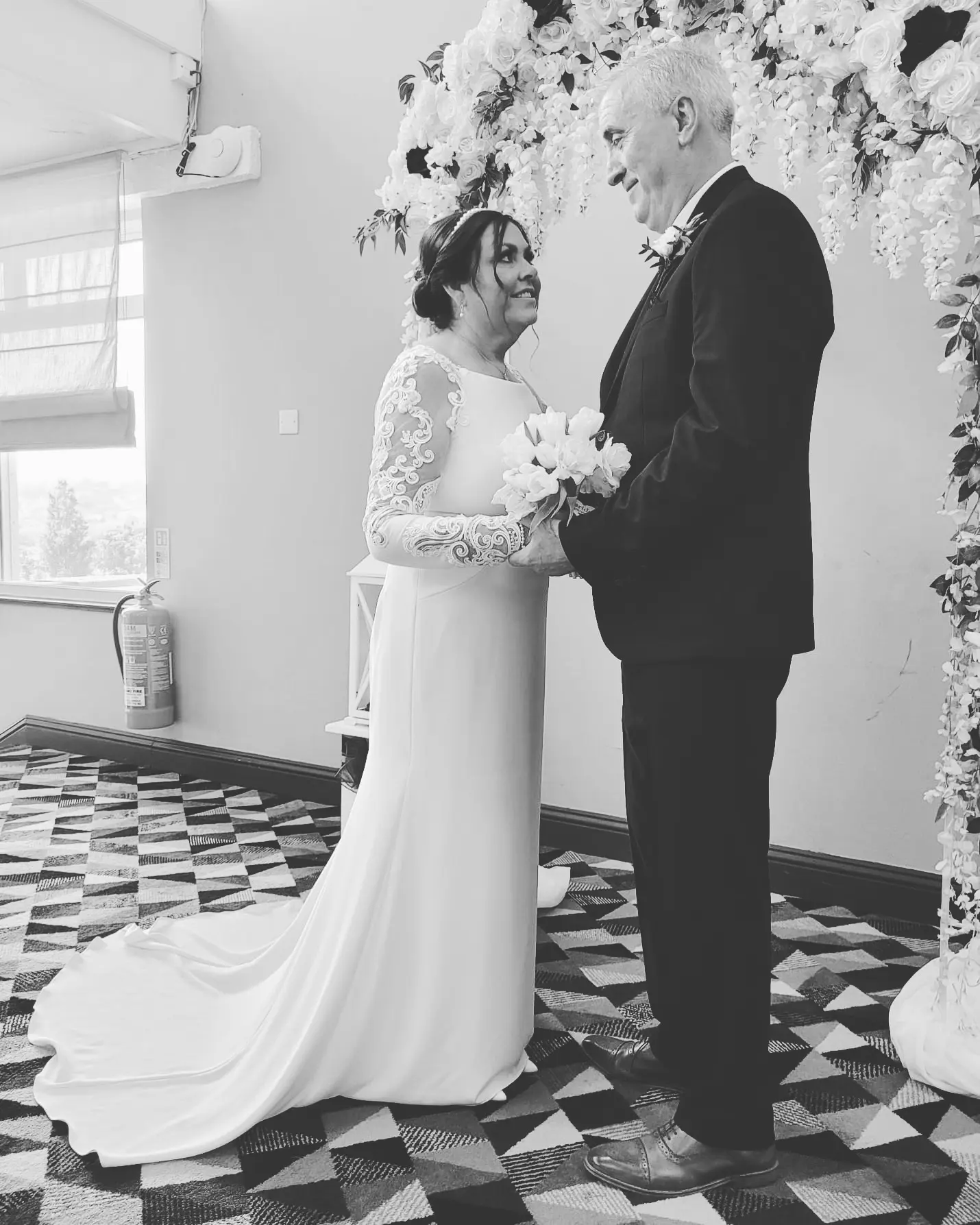 Bride in Crepe Long Sleeve Lace Sheath Wedding Dress named Bethany by Rebecca Ingram Bride with Groom
