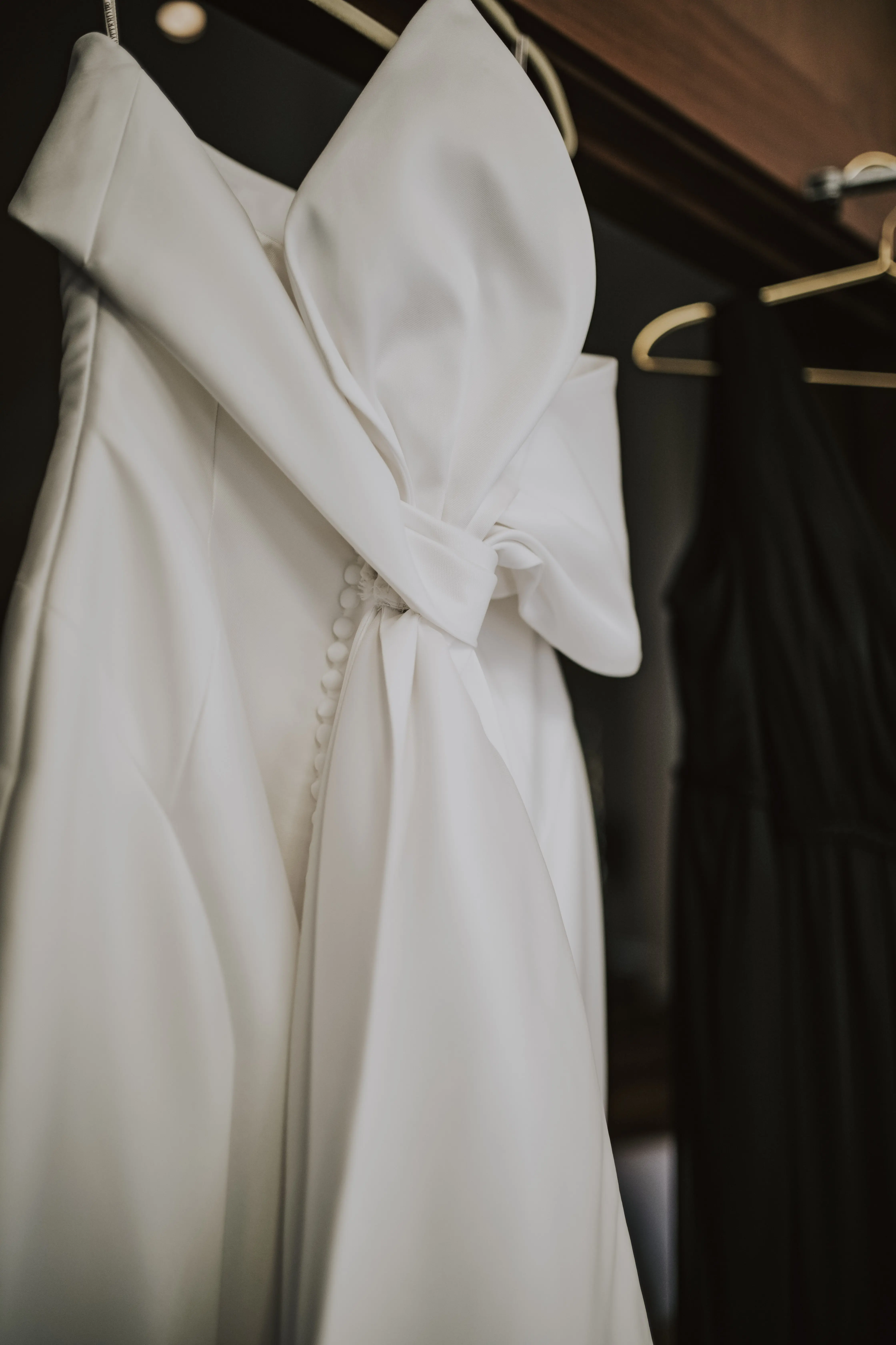 Mitchell wedding dress by Maggie Sottero hanging up