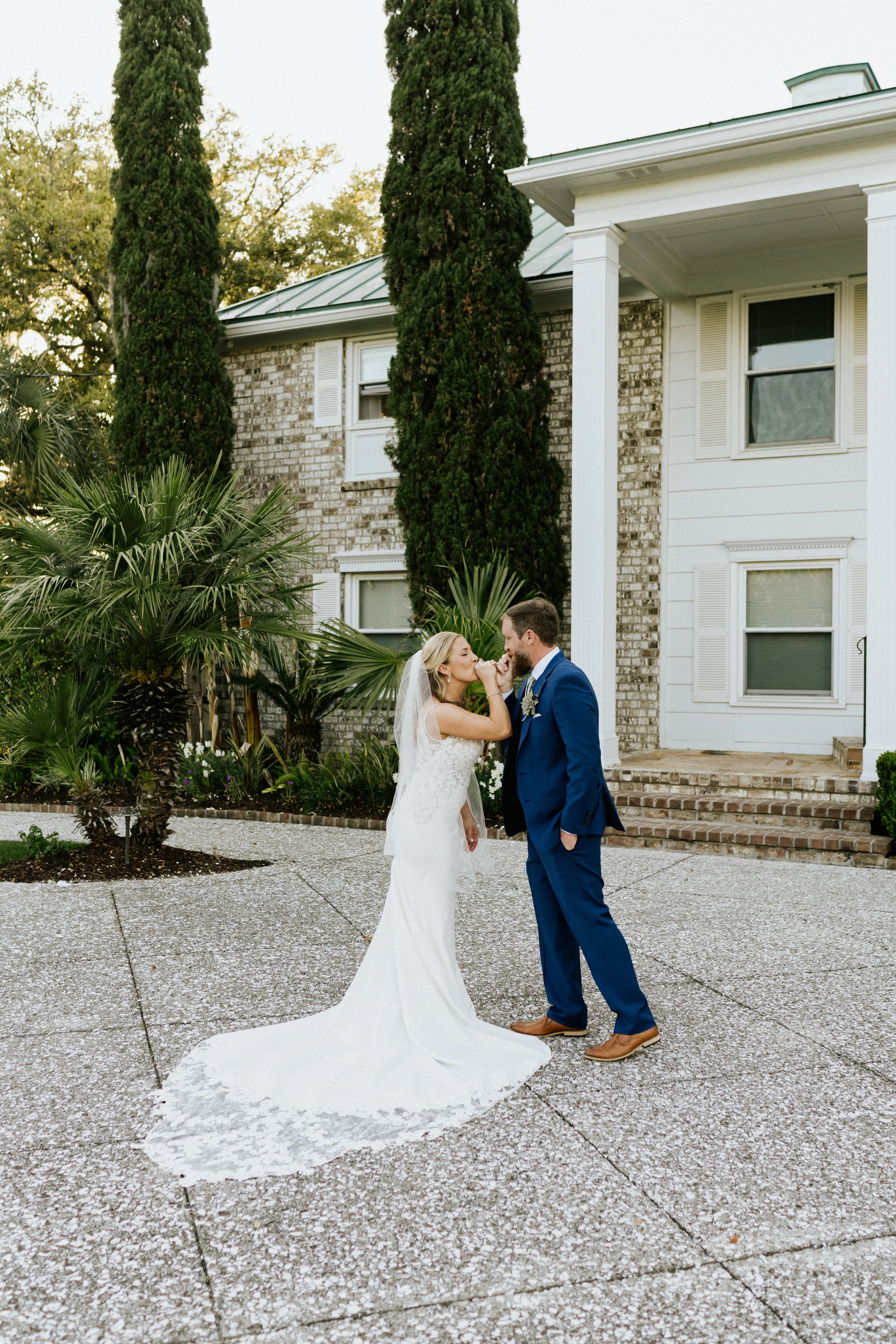 Groom With Bride In A Sleek Wedding Gown With Lace Spaghetti Straps Called Nikki By Maggie Sottero