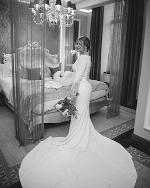 Bride in Crepe Fit-and-Flare Wedding Dress with Beaded Illusion Embroidery Featuring Swarovski Crystals Called Aston by Sottero & Midgley