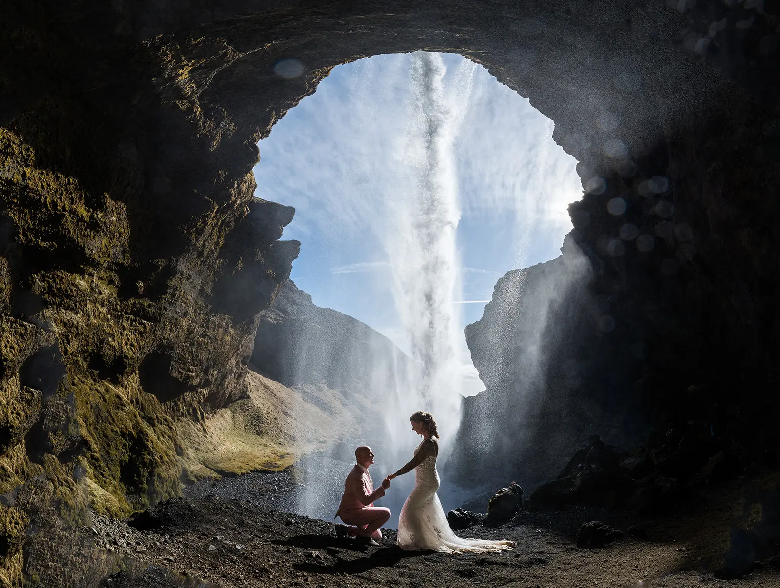 Bride wearing Tuscany Lynette by Maggie Sottero with her husband under a waterfall