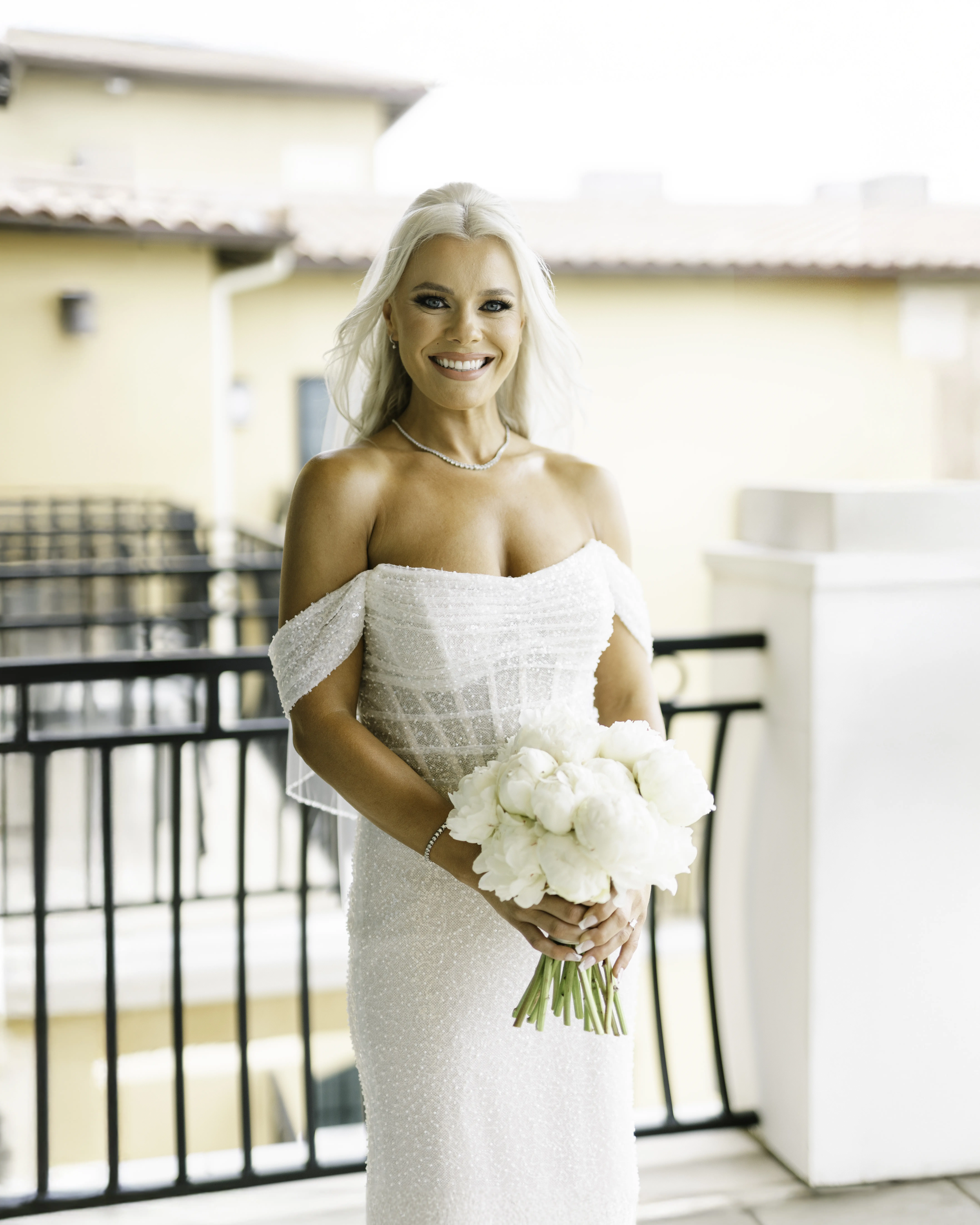 Bride Wearing Pearl Sparkly Bridal Gown Called Drew By Maggie Sottero Smiling Widely