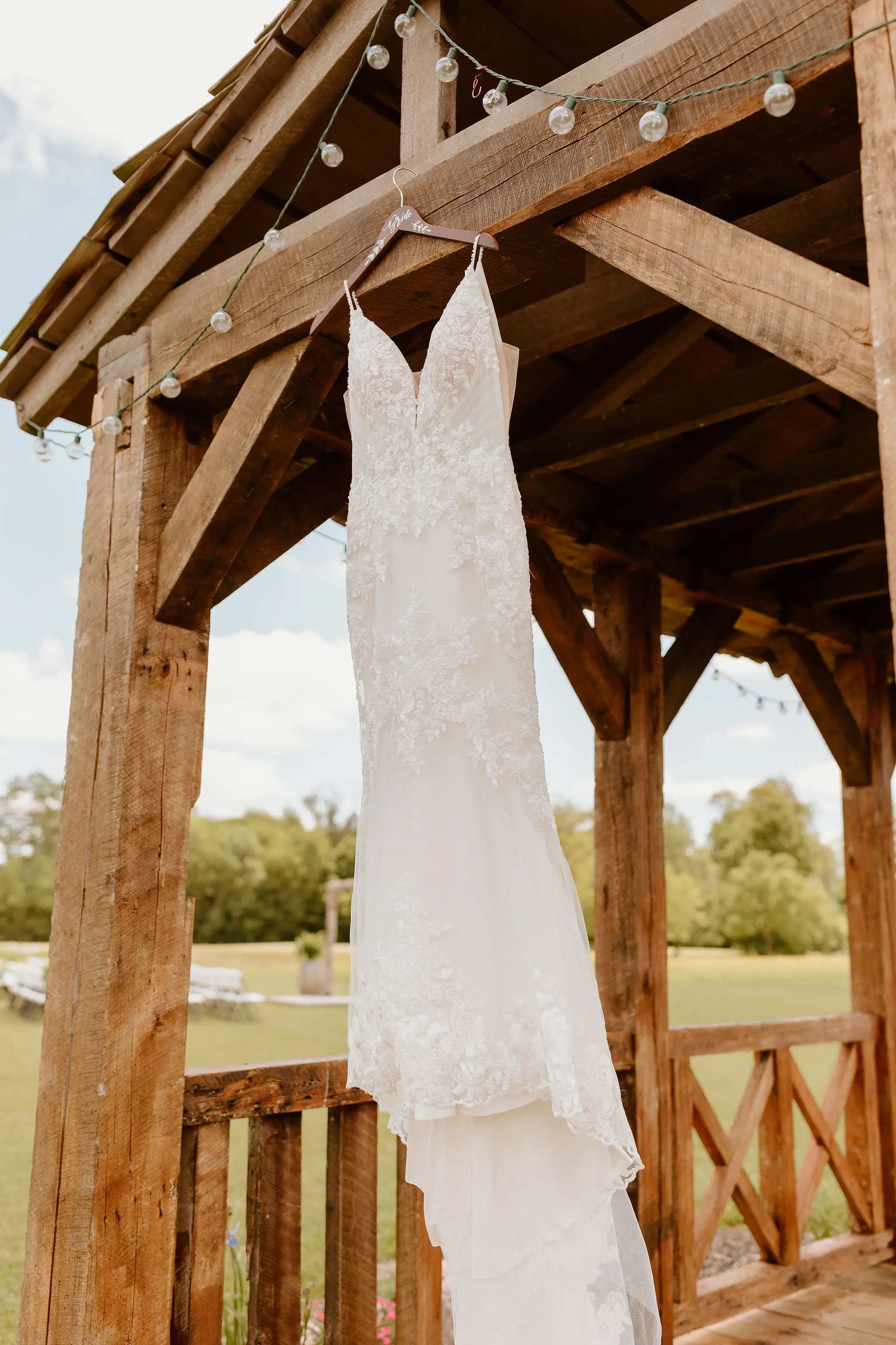 Floral Wedding Dress Called Fontaine By Maggie Sottero Hanging From Barn