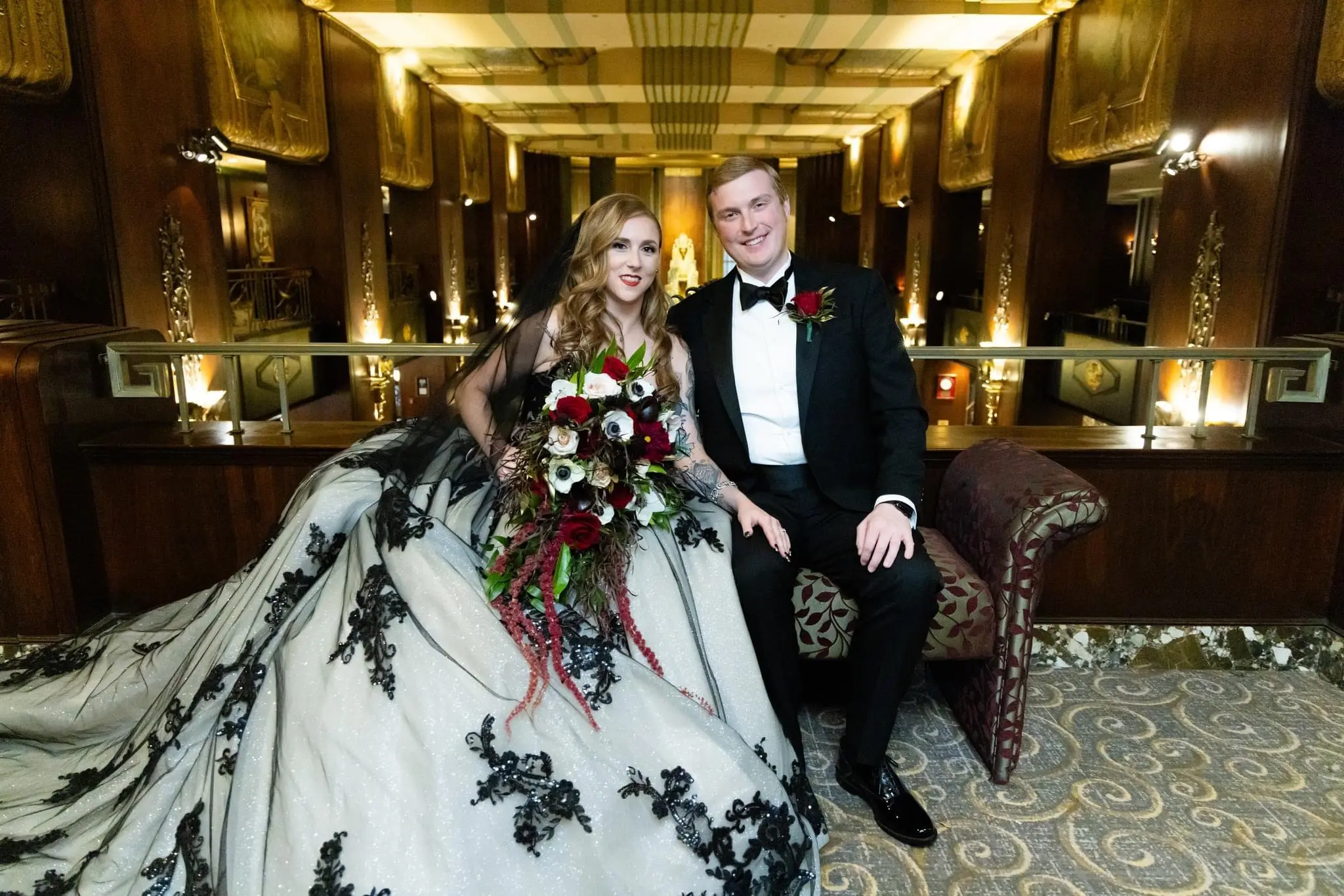 Bride wearing Norvinia wedding dress by Sottero and Midgley sitting with her husband