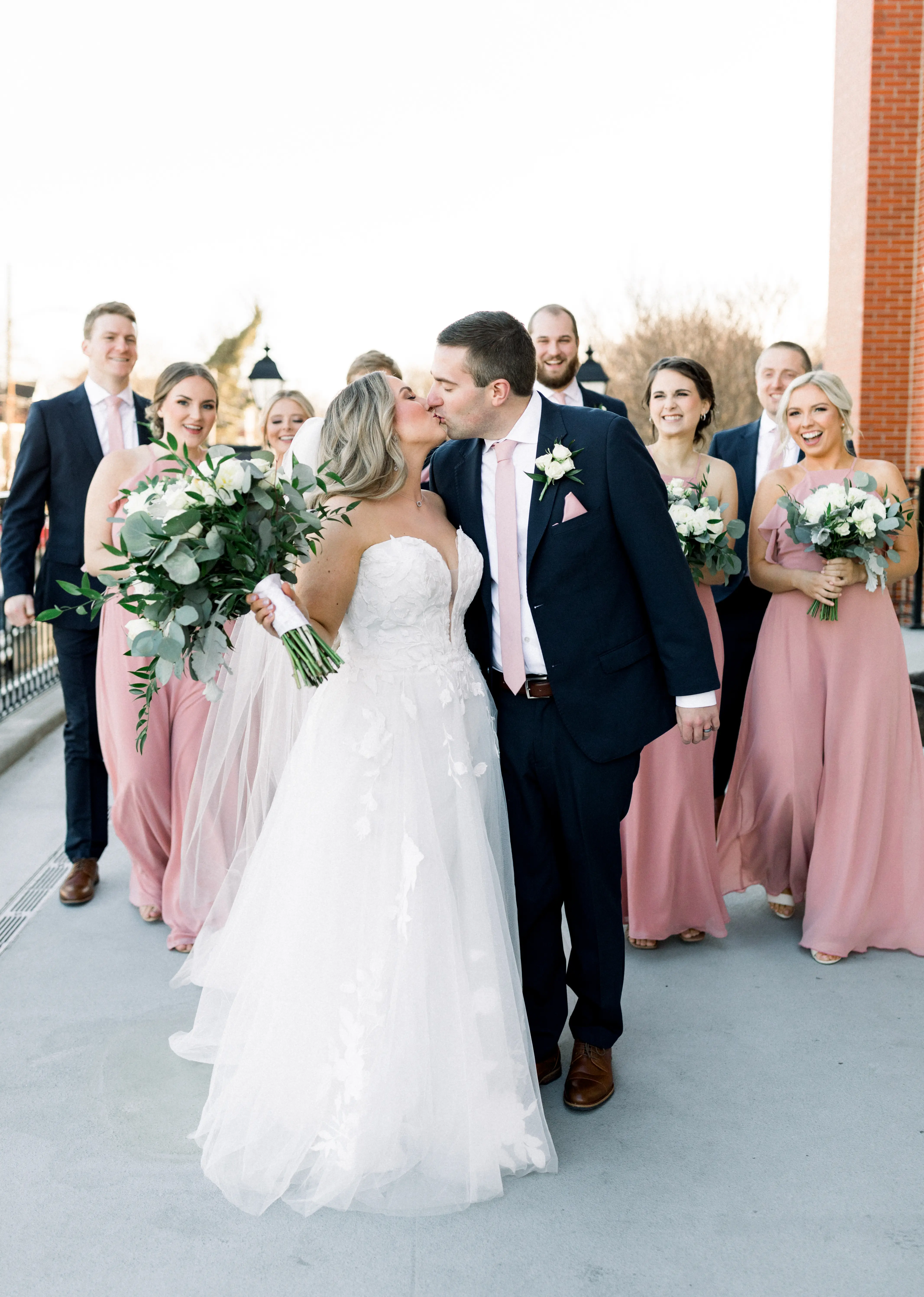 Bride wearing Hattie Lane Marie wedding dress by Rebecca Ingram with groom and bridal party