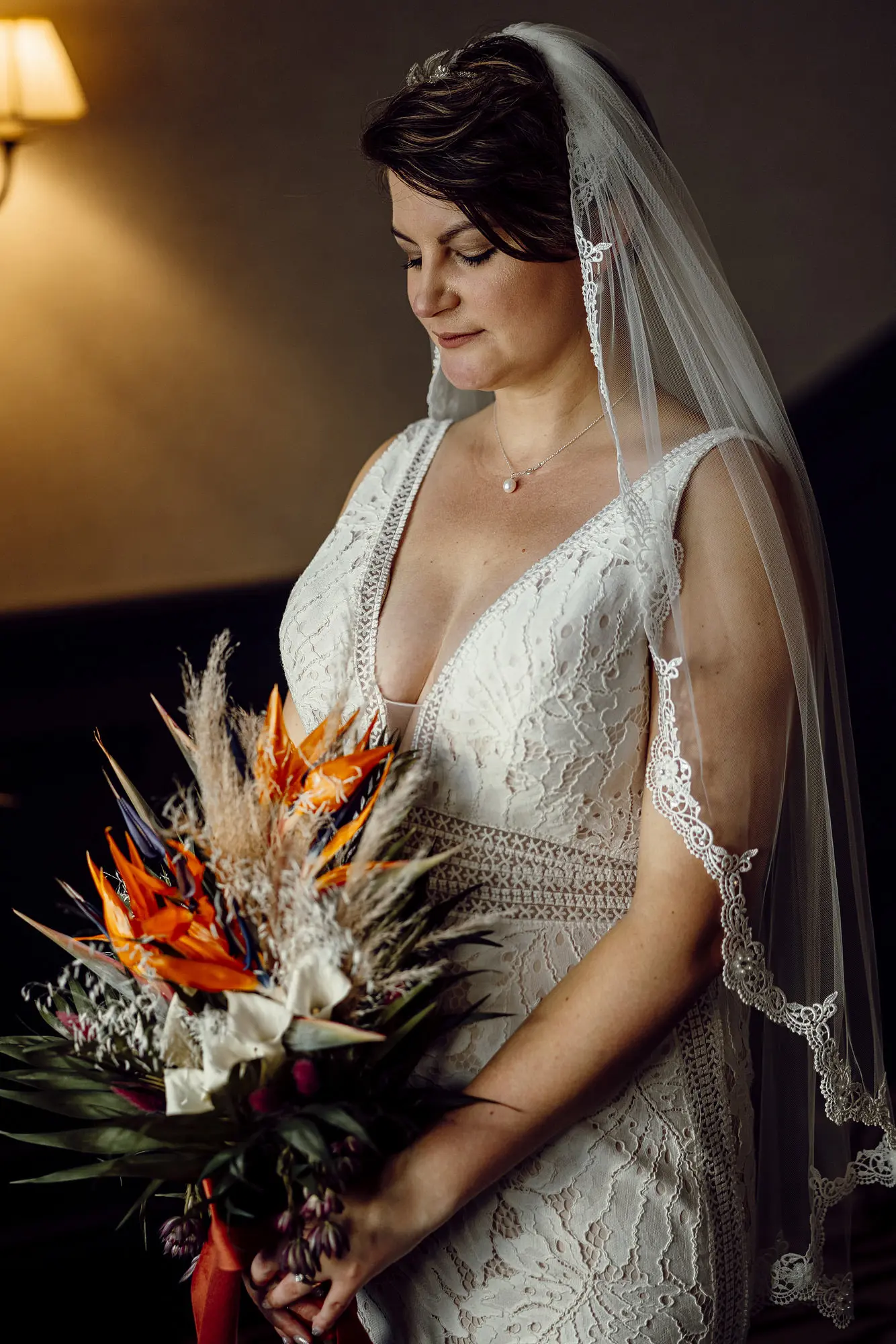 Bride Wearing Boho Lace Wedding Dress Called Burke By Maggie Sottero Holding Tropical Inspired Bouquet