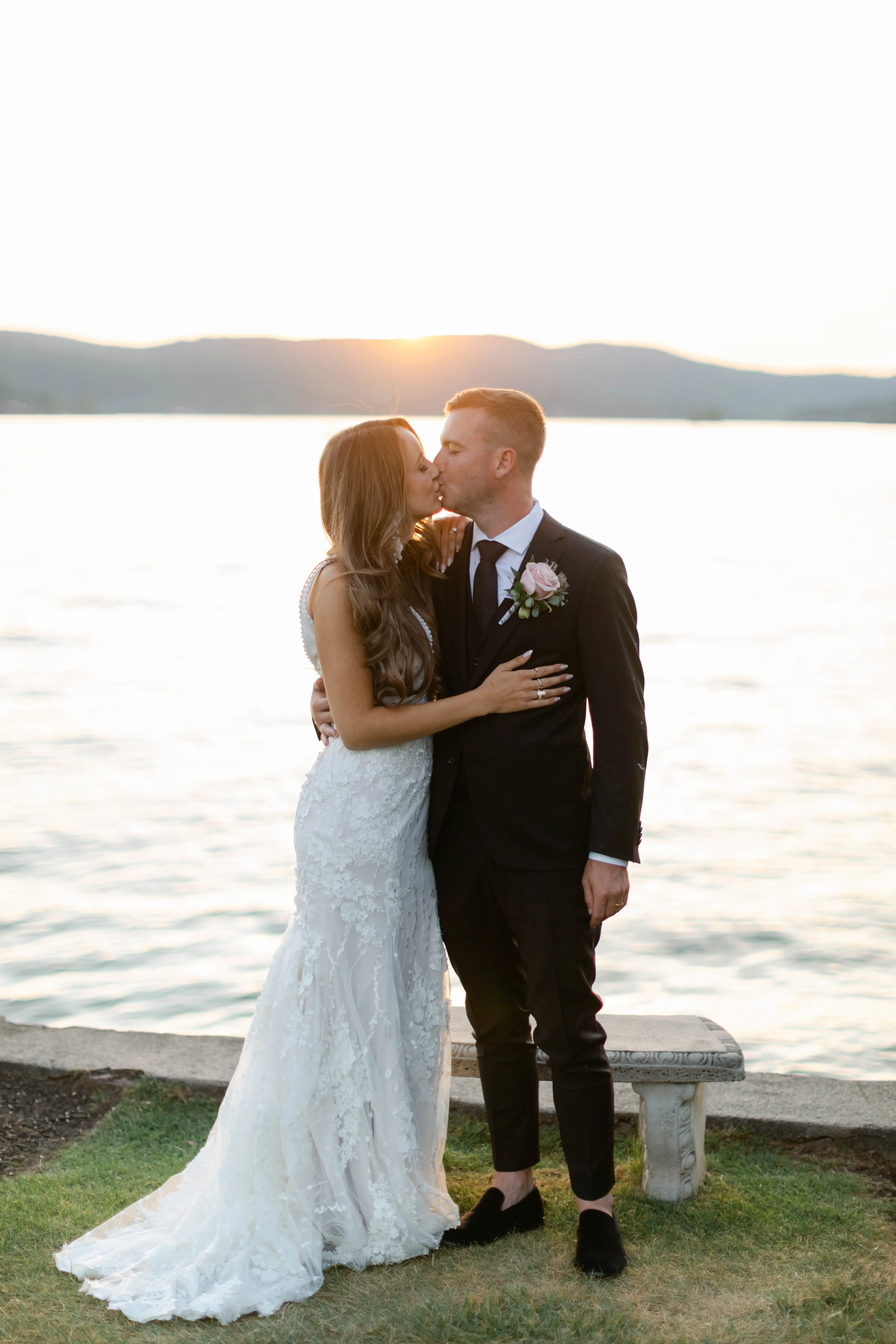 Groom Kissing Bride in Mermaid Wedding Dress with 3-D Floral Motifs Called Cruz by Sottero & Midgley