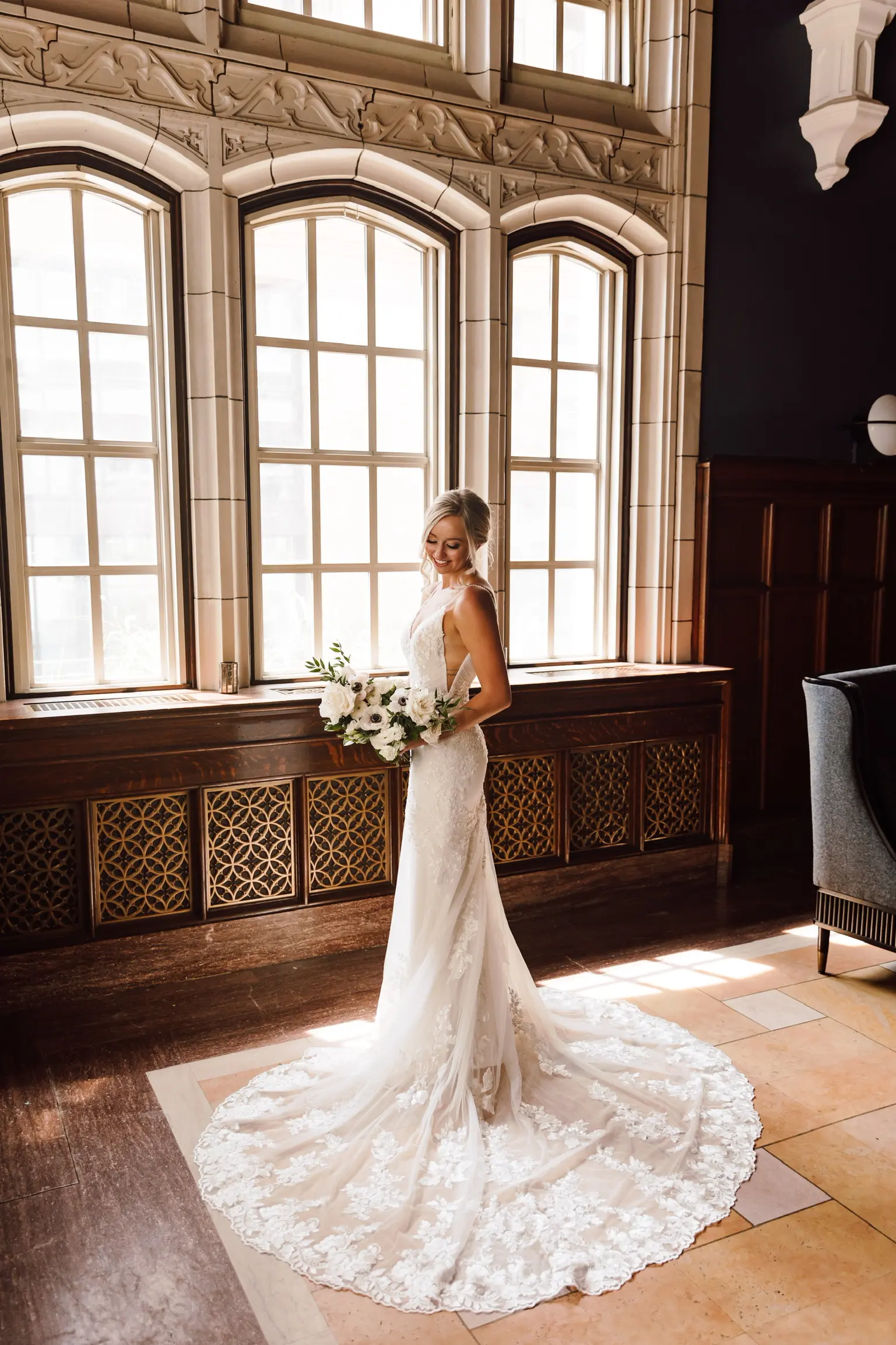Bride Wearing Sparkle Lace Long Train Wedding Dress Called Fontaine By Maggie Sottero Light Shining Through Bright Windows
