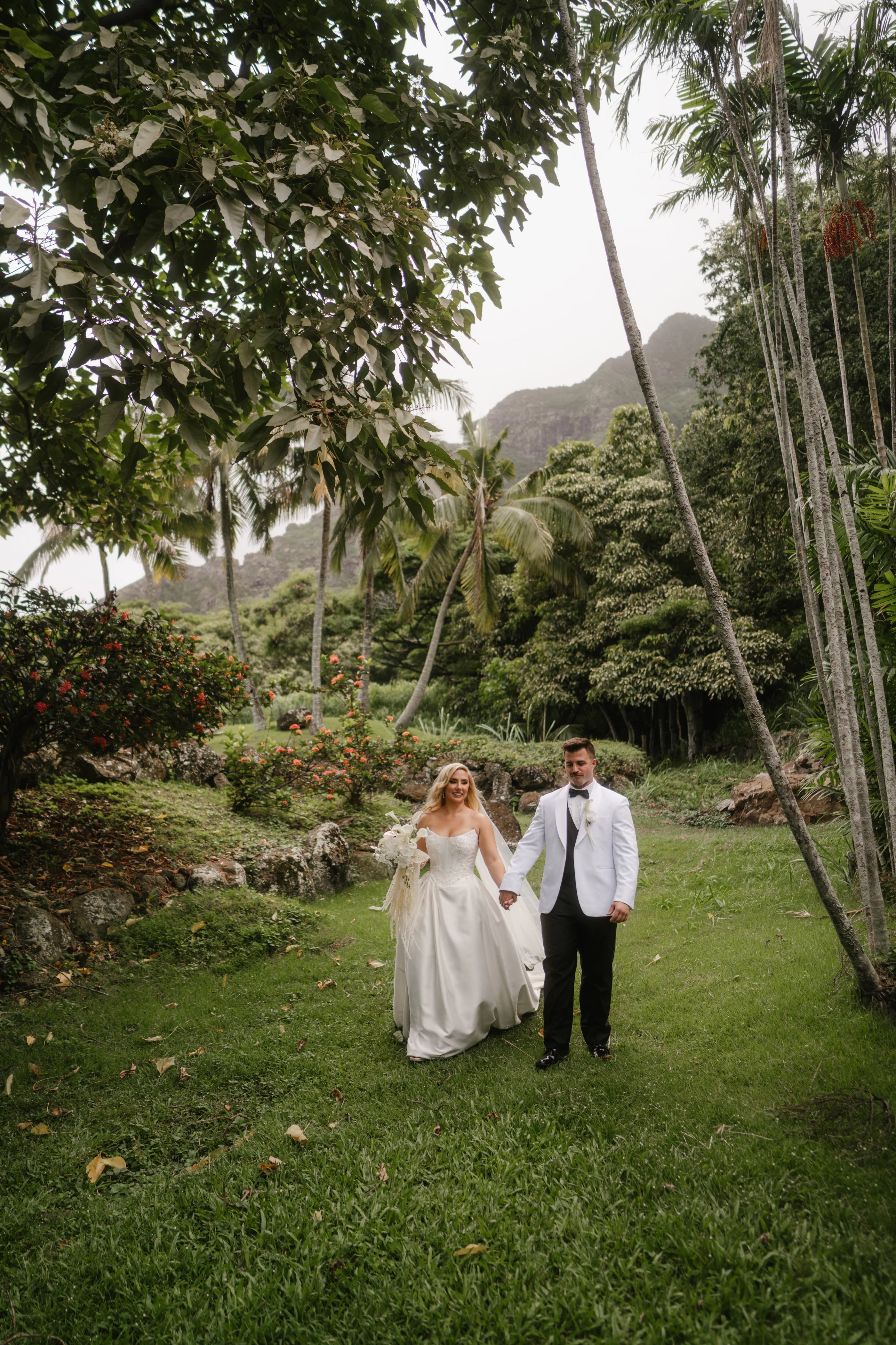 Bride Wearing Sexy Slit Satin Wedding Dress Called Amadora By Sottero And Midgley Walking With Groom